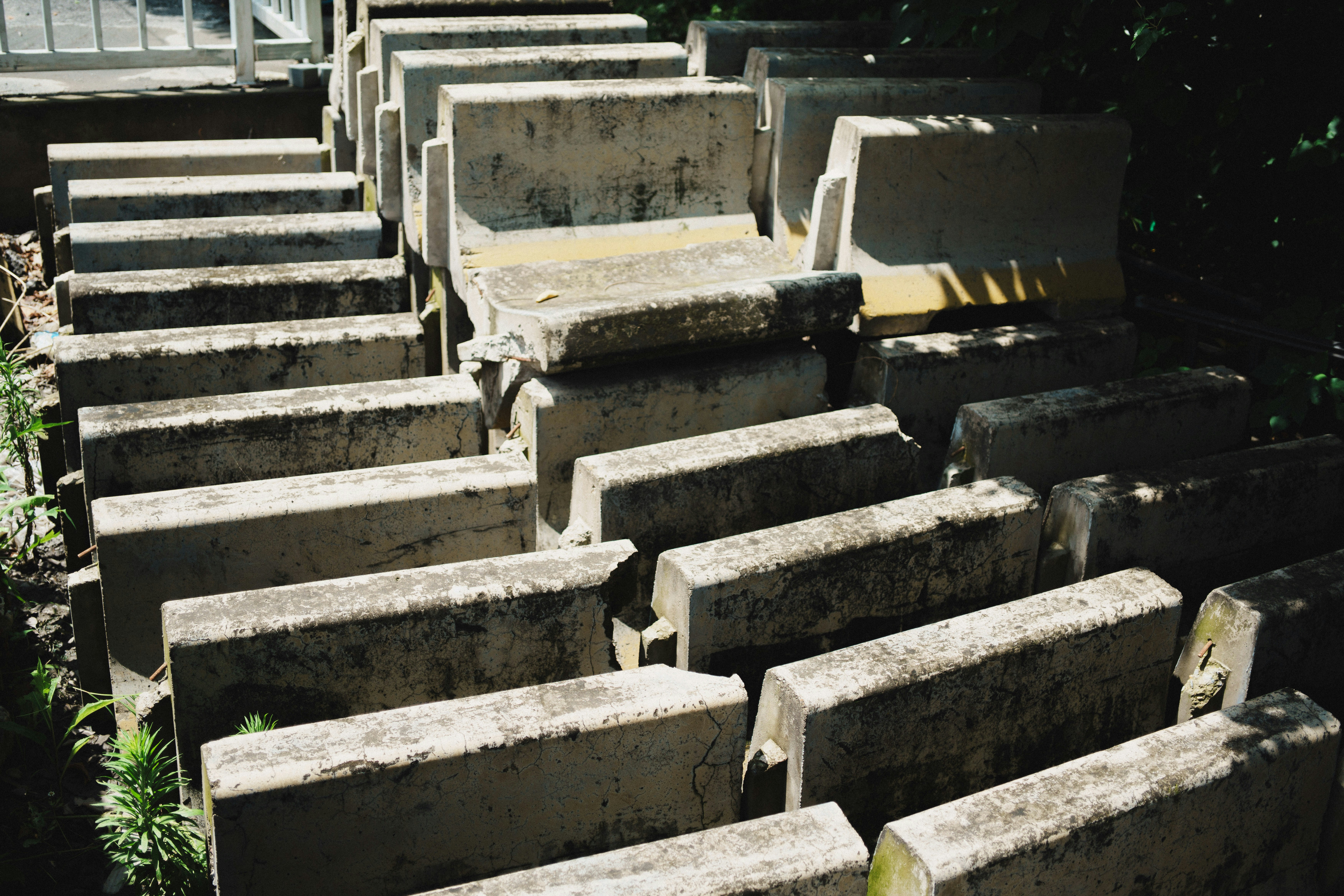 Rows of concrete barriers stacked outdoors.