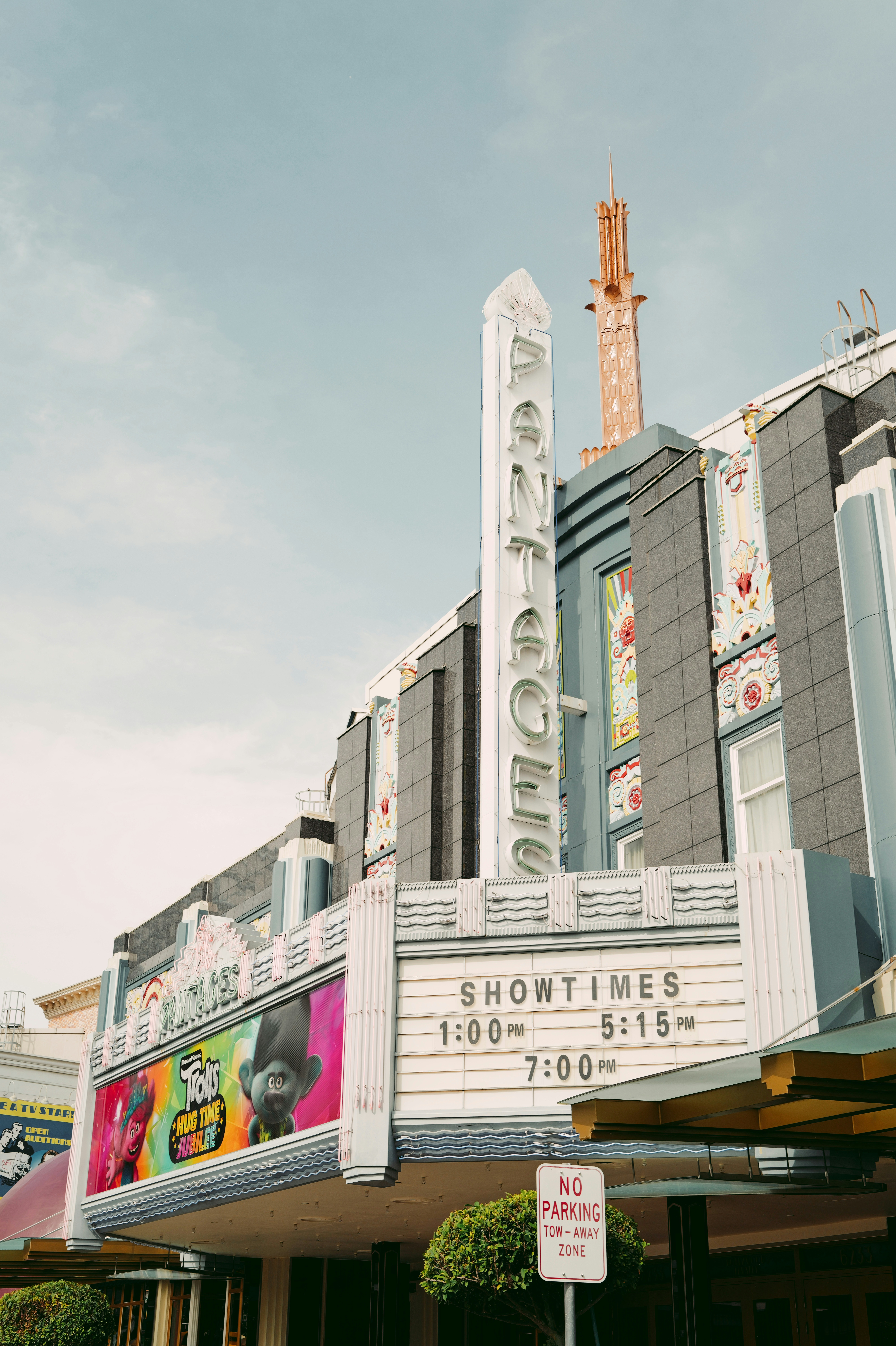 Art deco movie theater with showtimes displayed