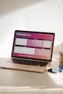 Laptop displaying a colorful february 2026 calendar.