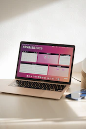 Laptop displaying a colorful february 2026 calendar.
