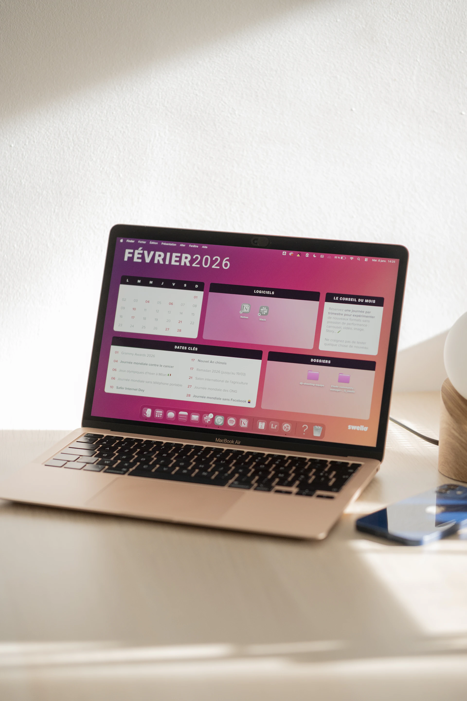 Laptop displaying a colorful february 2026 calendar.