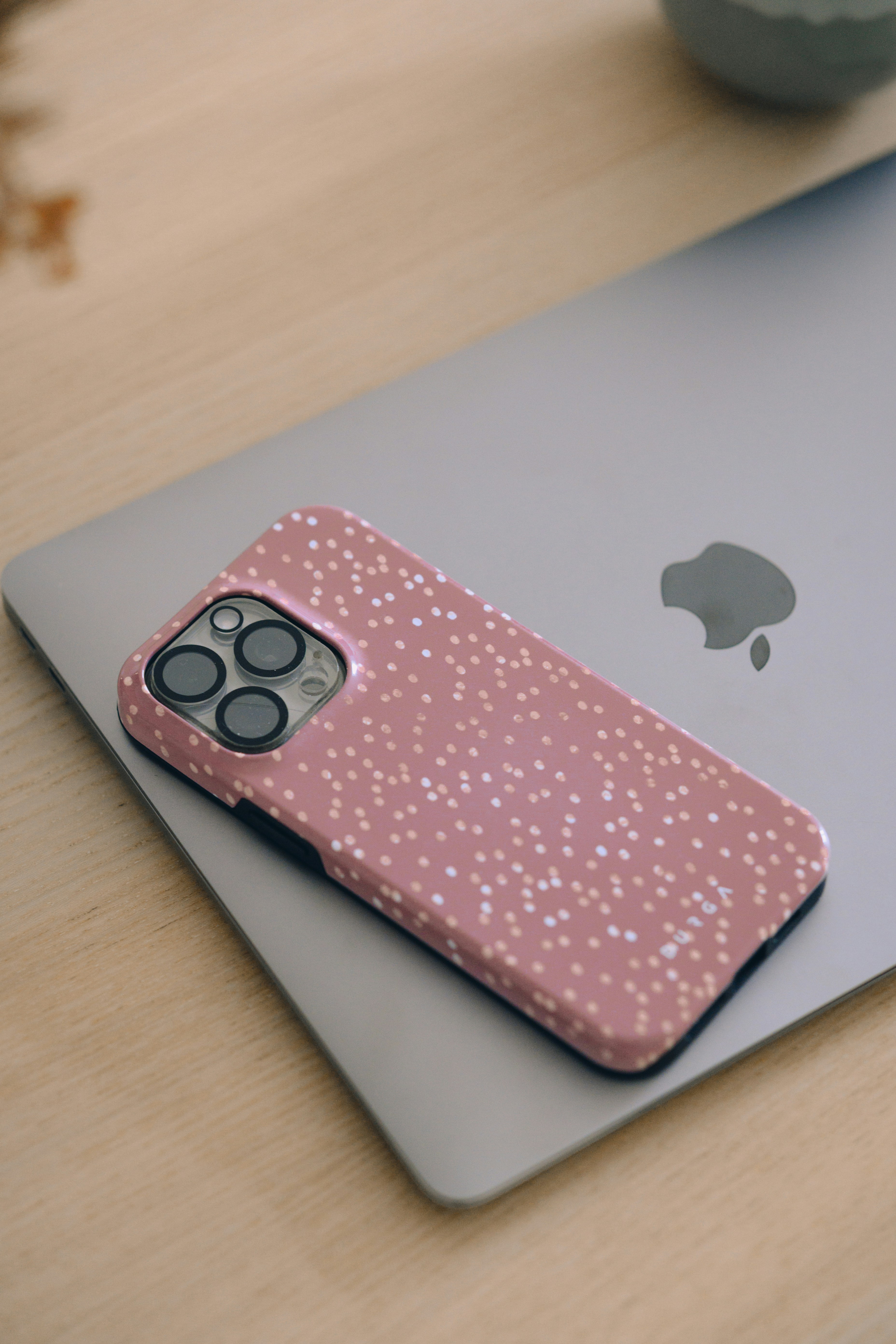 Pink phone case on a laptop