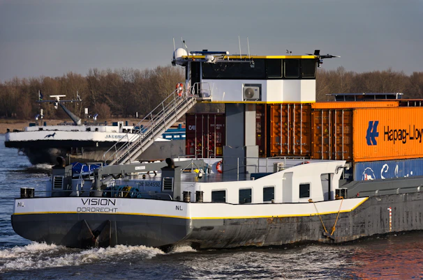 Two cargo ships sailing on a river
