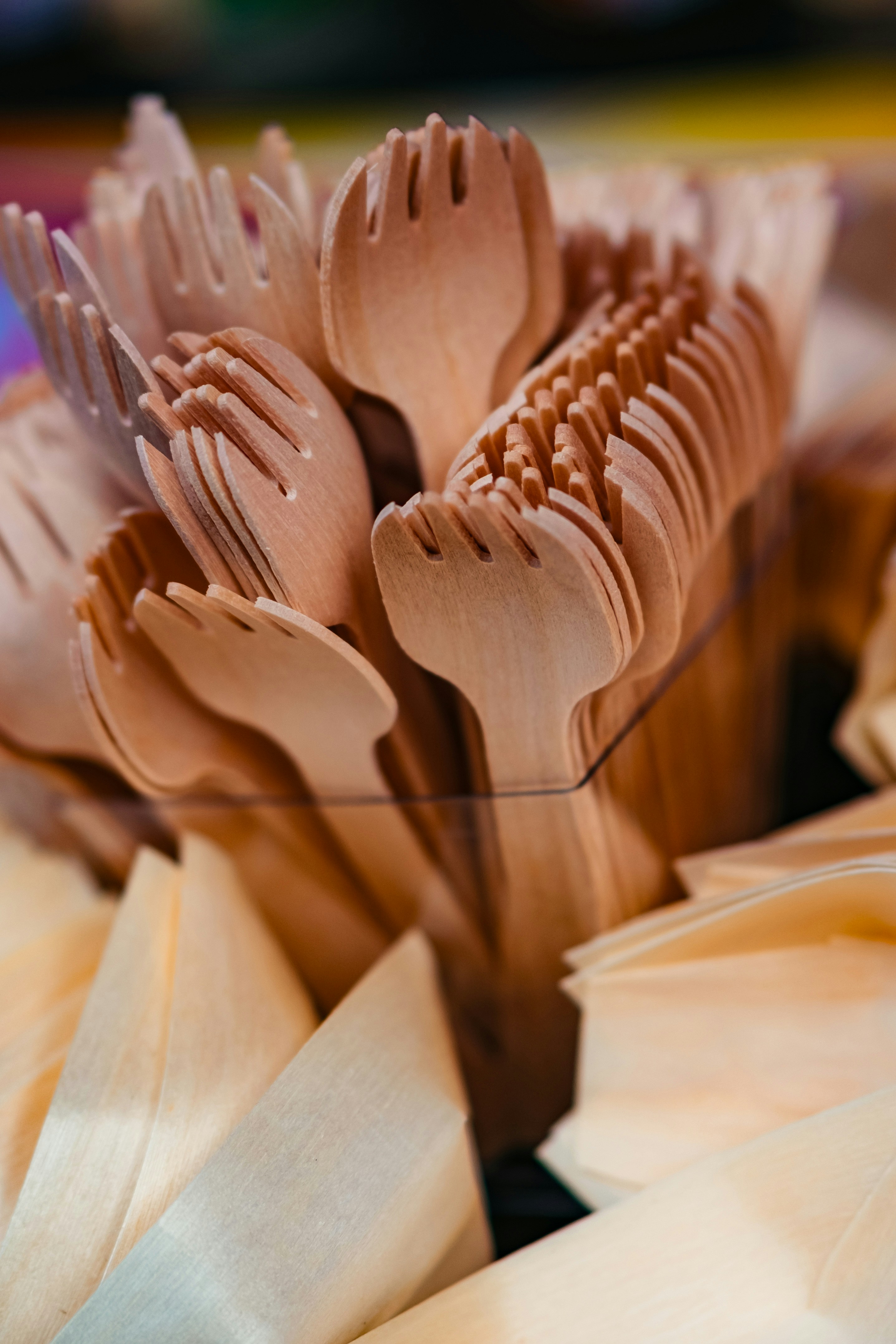 Stack of wooden forks and napkins ready for use