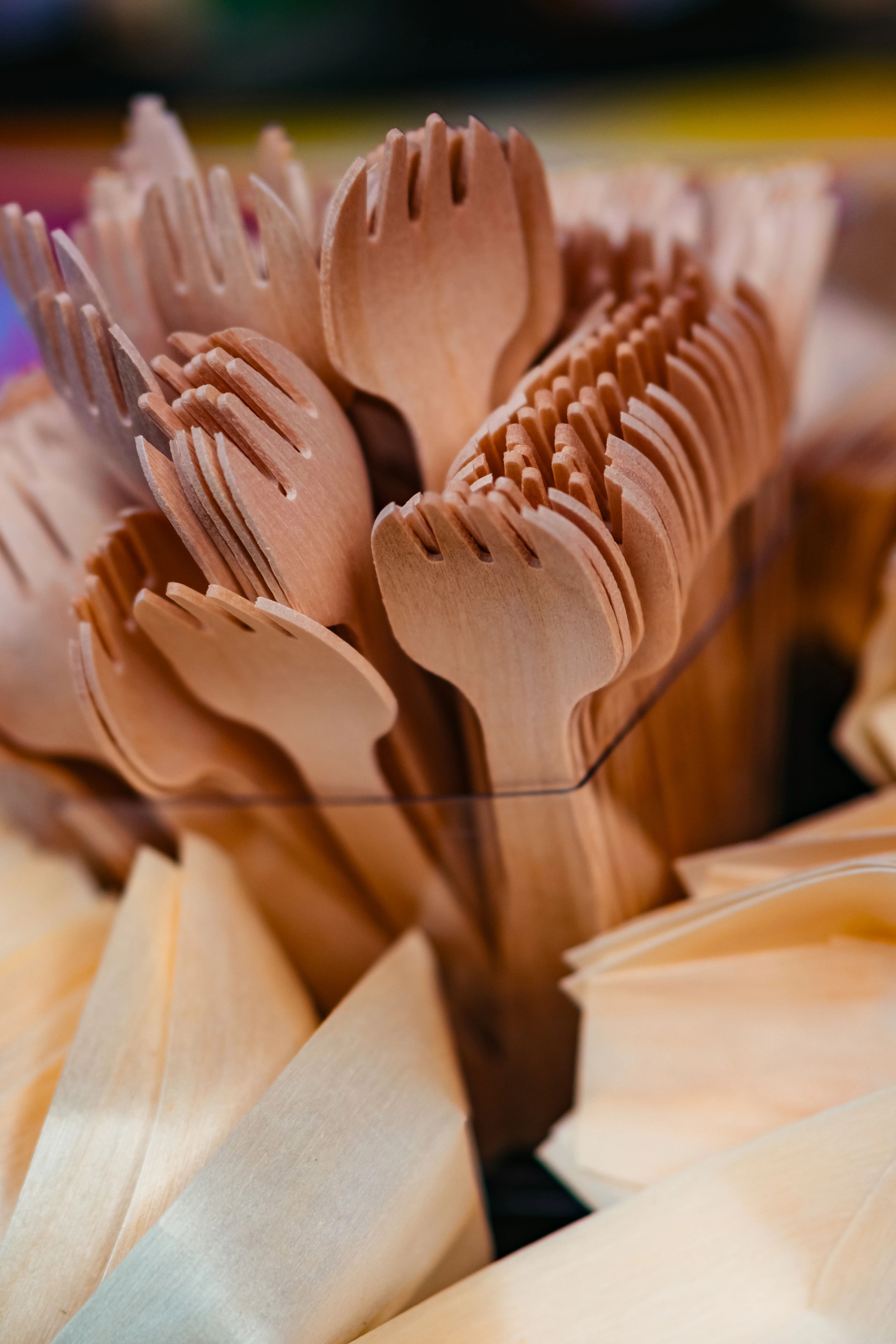 A bundle of wooden forks and spoons ready for service