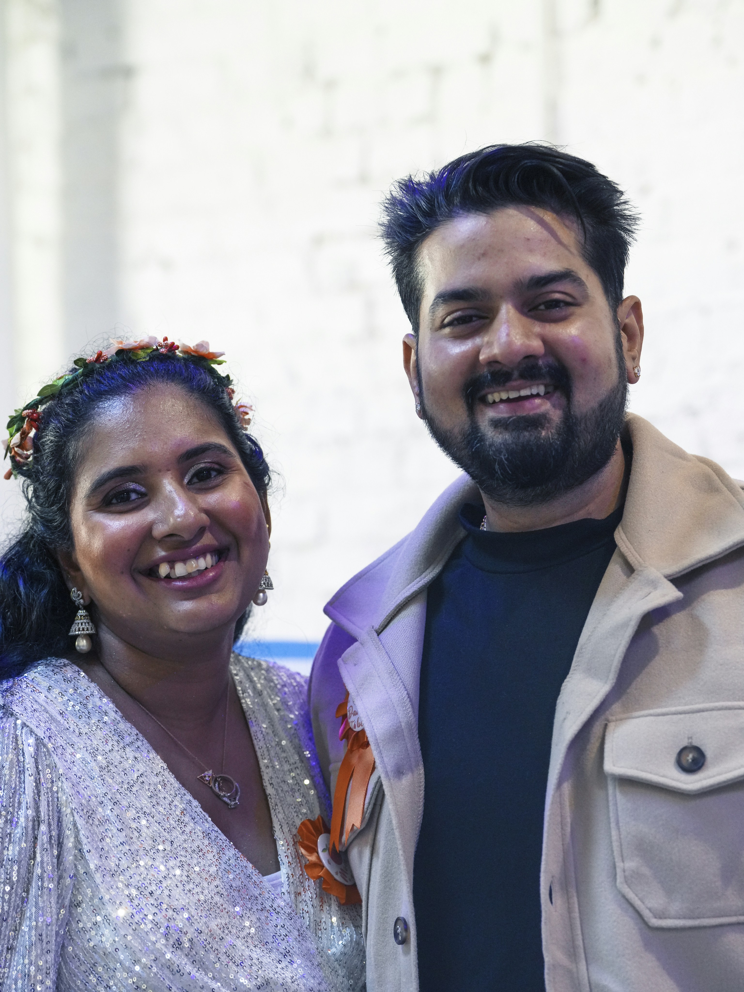 A smiling couple poses for a photo