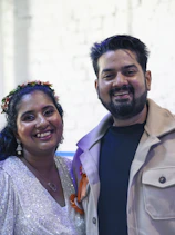 A smiling couple poses for a photo