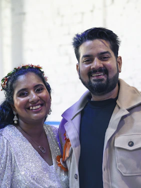 A smiling couple poses for a photo
