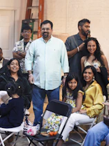 A diverse group of people gathered indoors.
