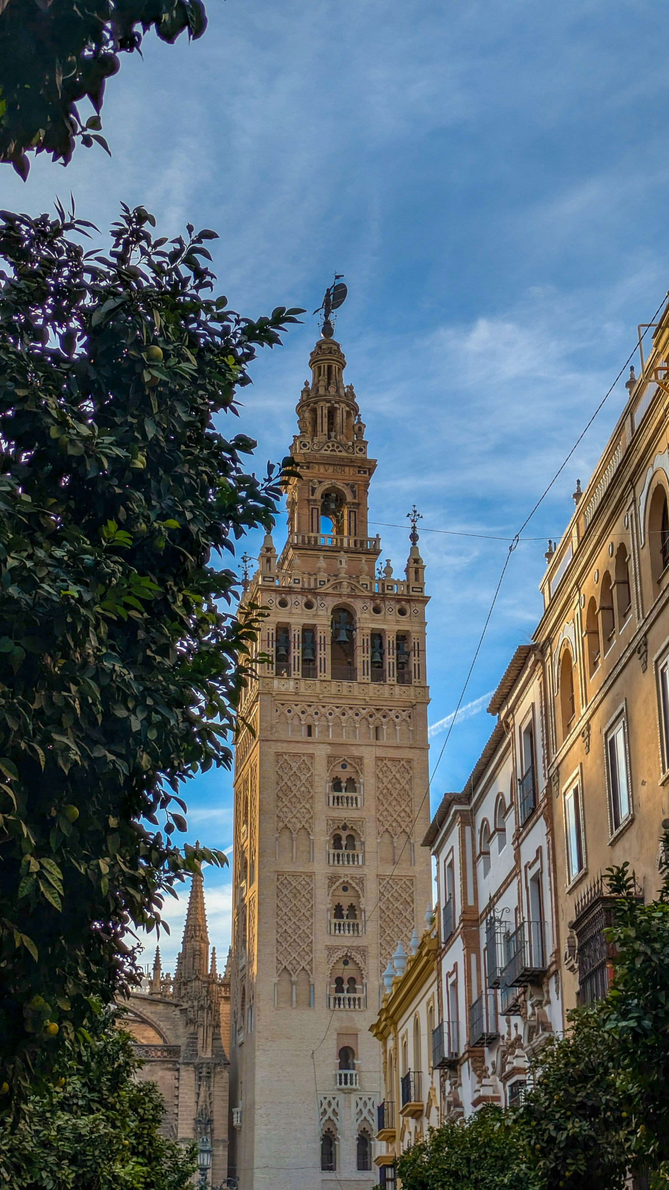 A tall ornate tower against a blue sky