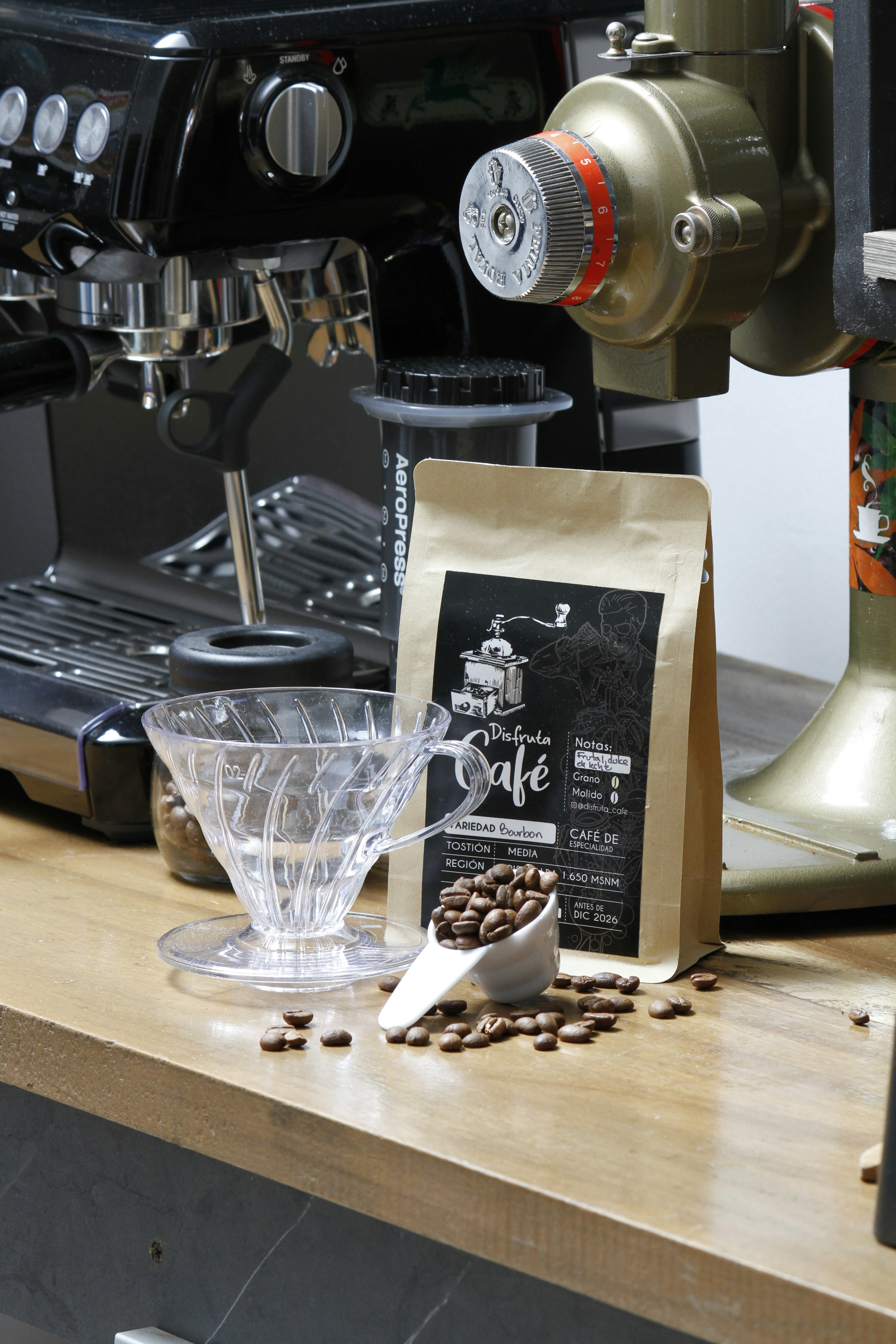 Coffee beans and brewing equipment on a wooden counter