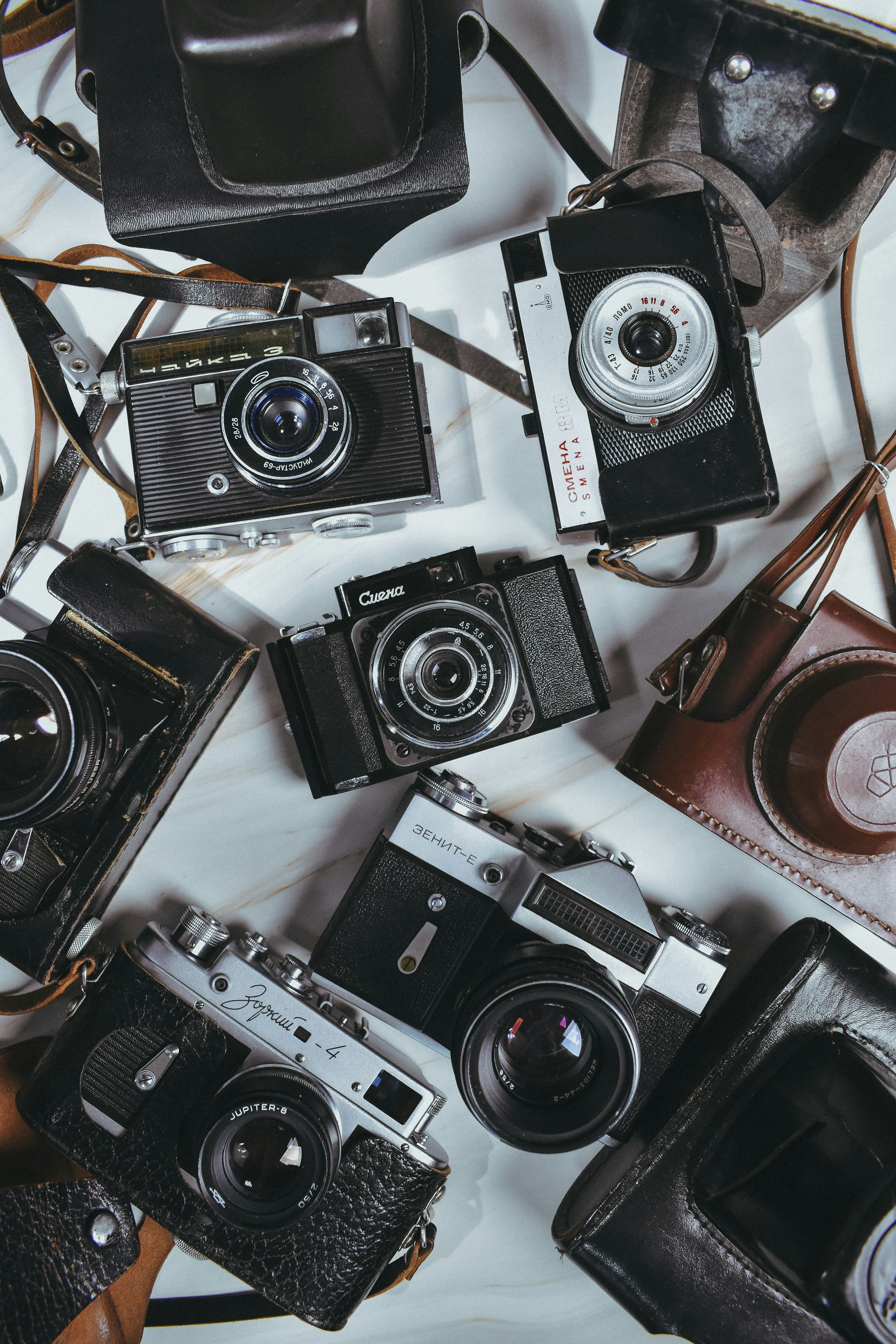 Collection of vintage cameras and leather cases