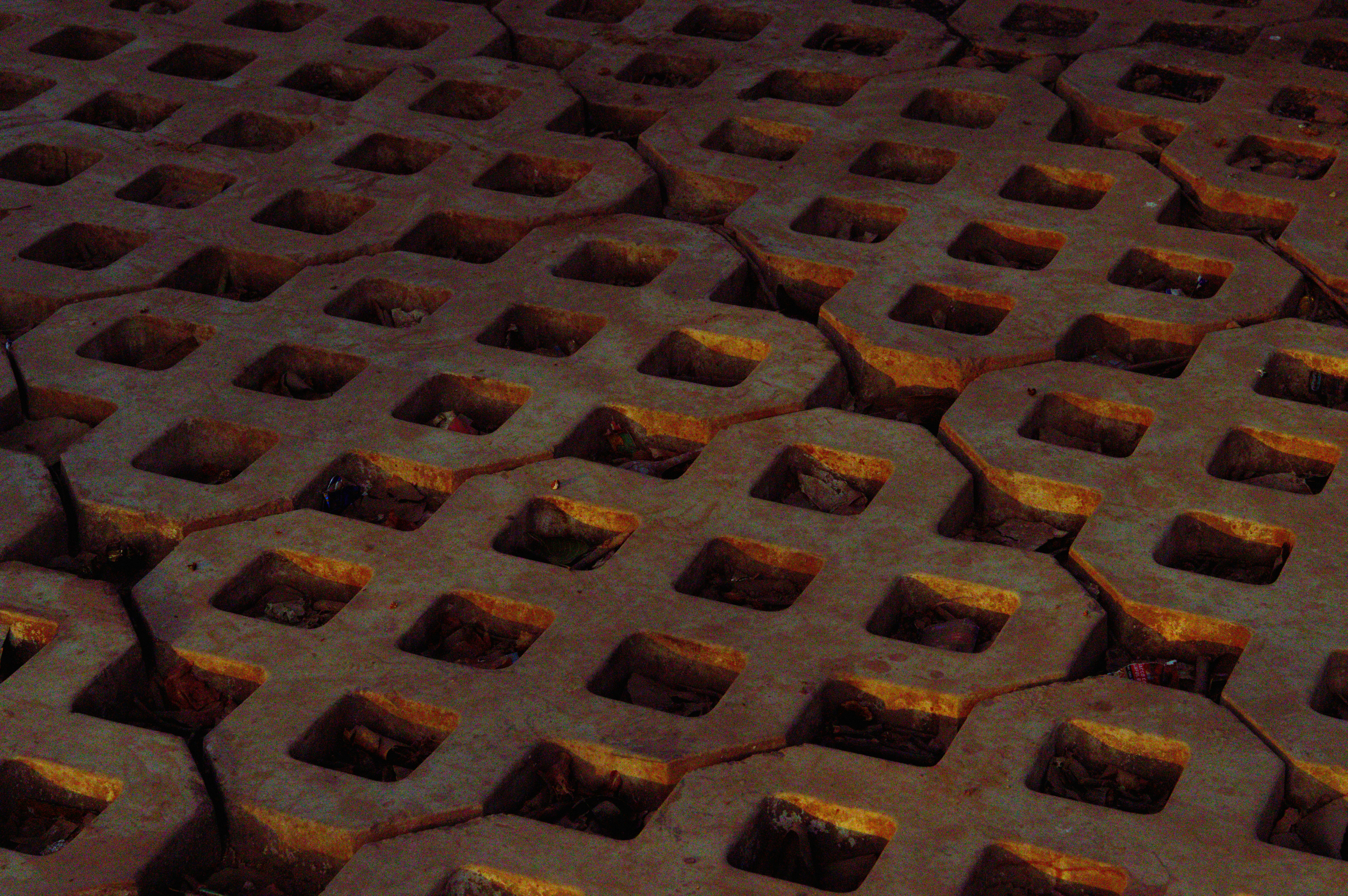 Cracked concrete pavers with square openings