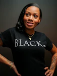 A woman wearing black identity merchandise