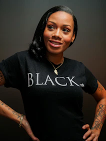 A woman wearing black identity merchandise