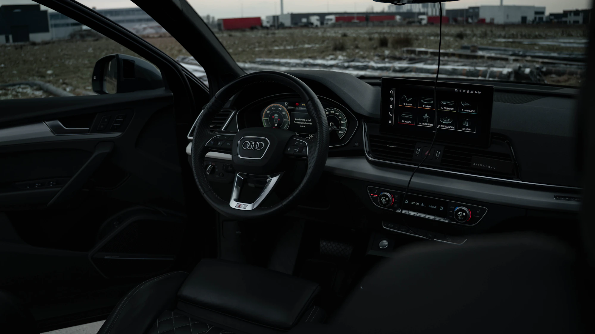 Premium car dashboard and steering wheel in a refined modern cabin