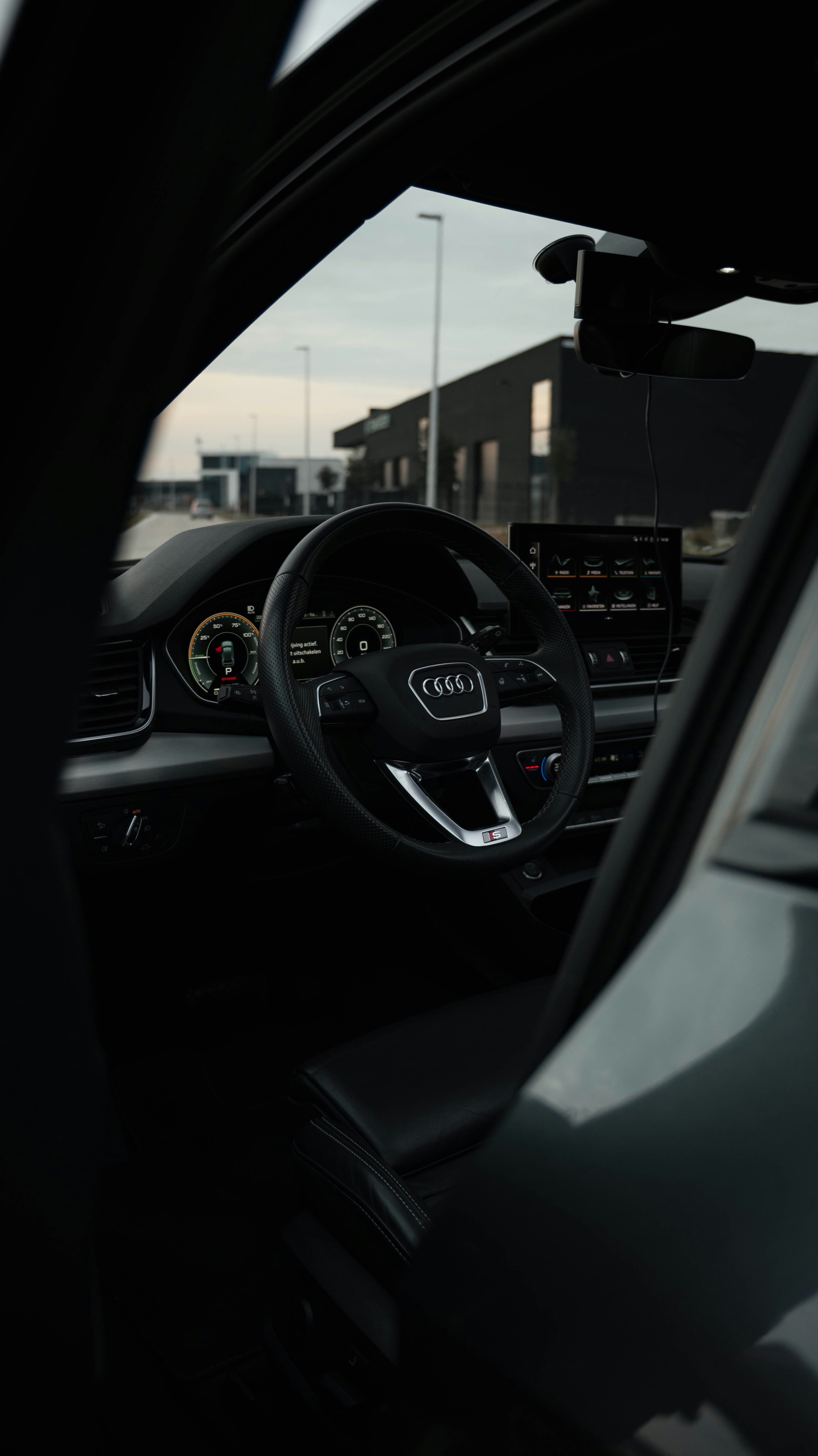 Interior view of a modern audi car dashboard.