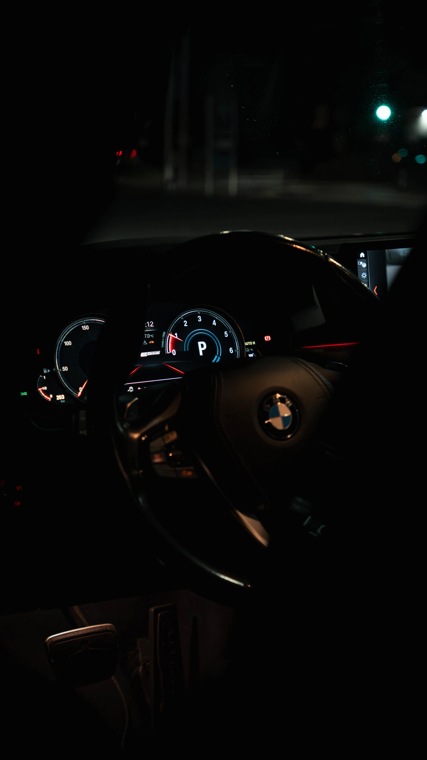 Illuminated digital vehicle dashboard used during nighttime driving