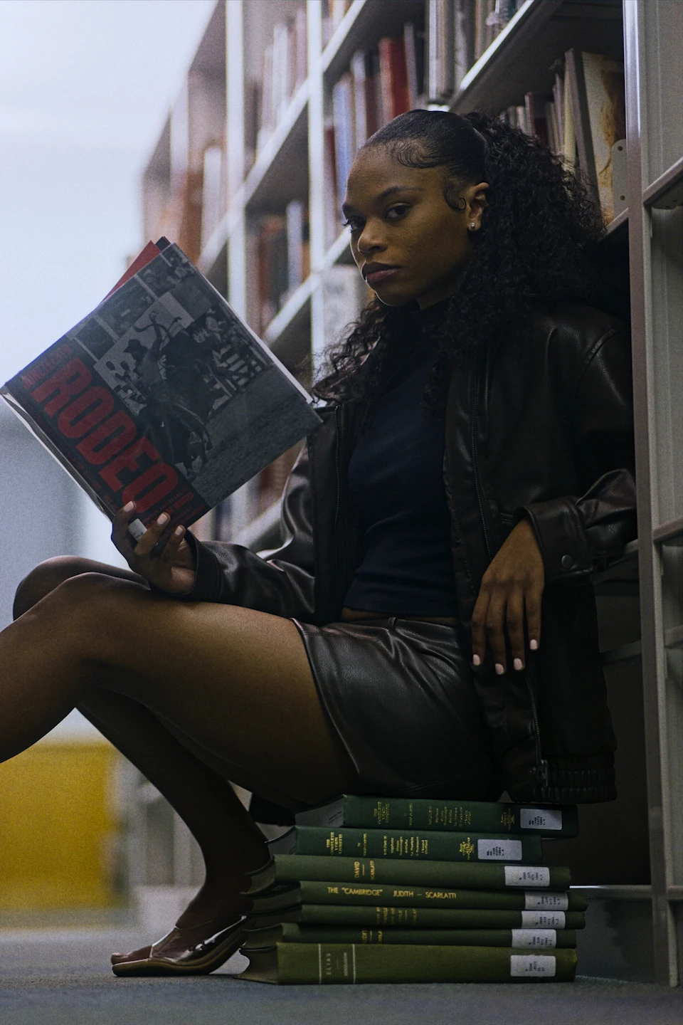 Reader studying books in a library