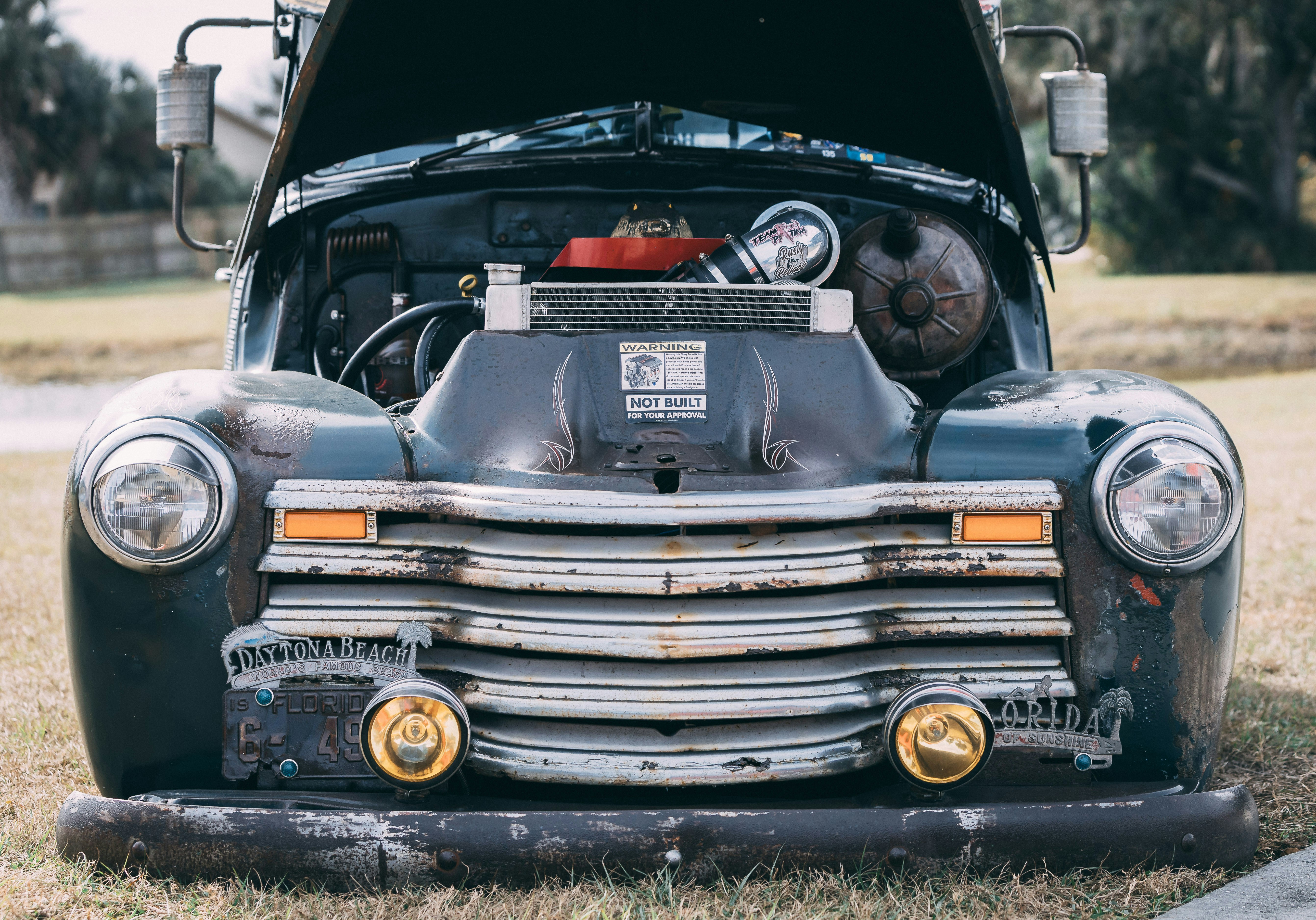 Vintage dark green truck with hood open