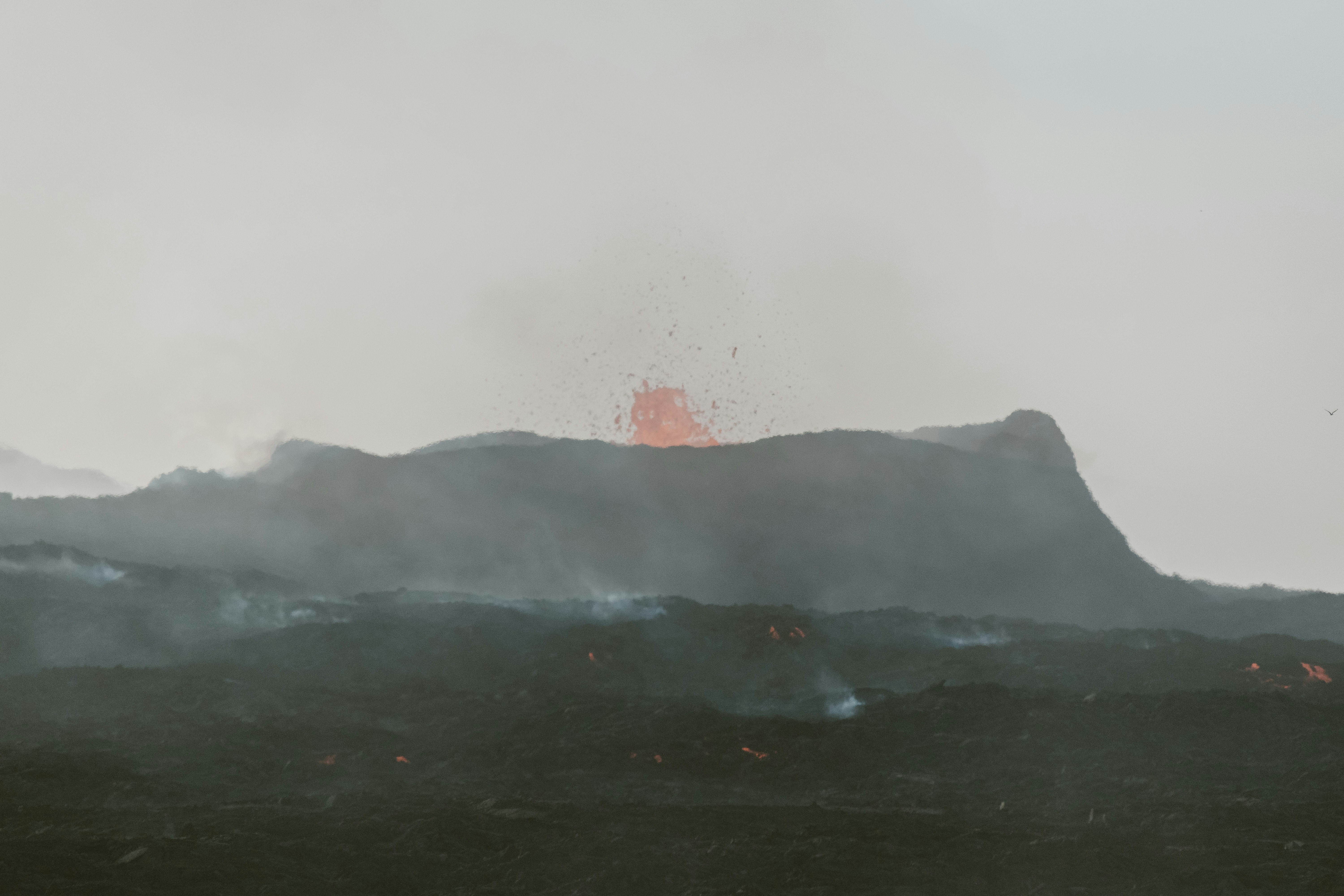 Volcano erupting with lava and smoke