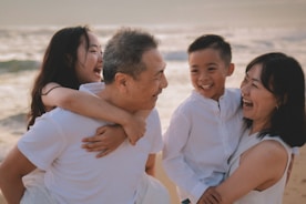 Happy family laughing together on a beach