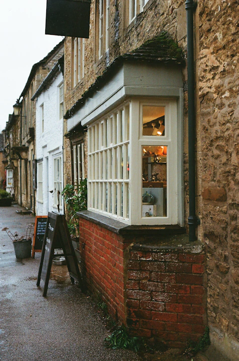 Quaint shop window on a cobblestone street