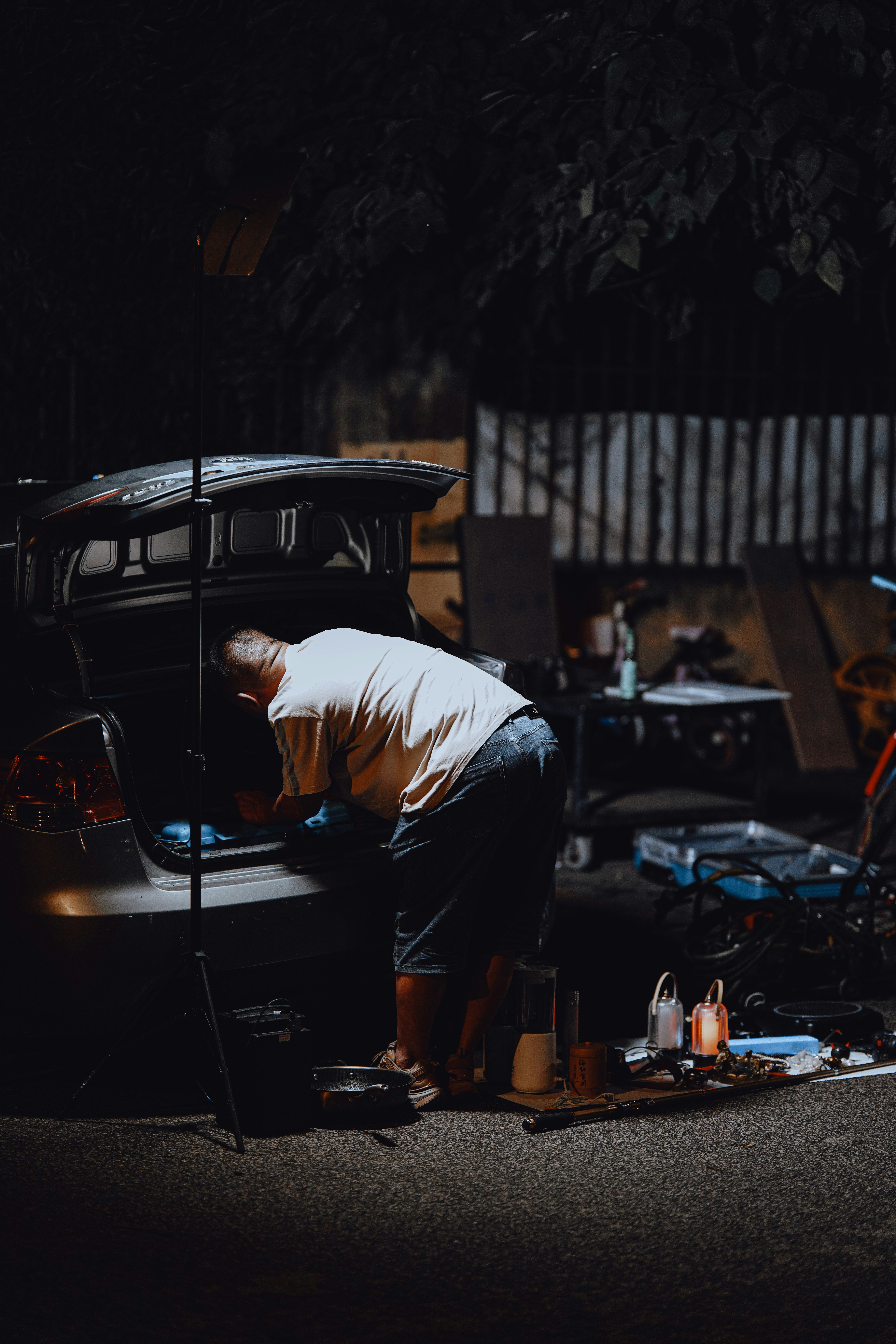 person doing car repair