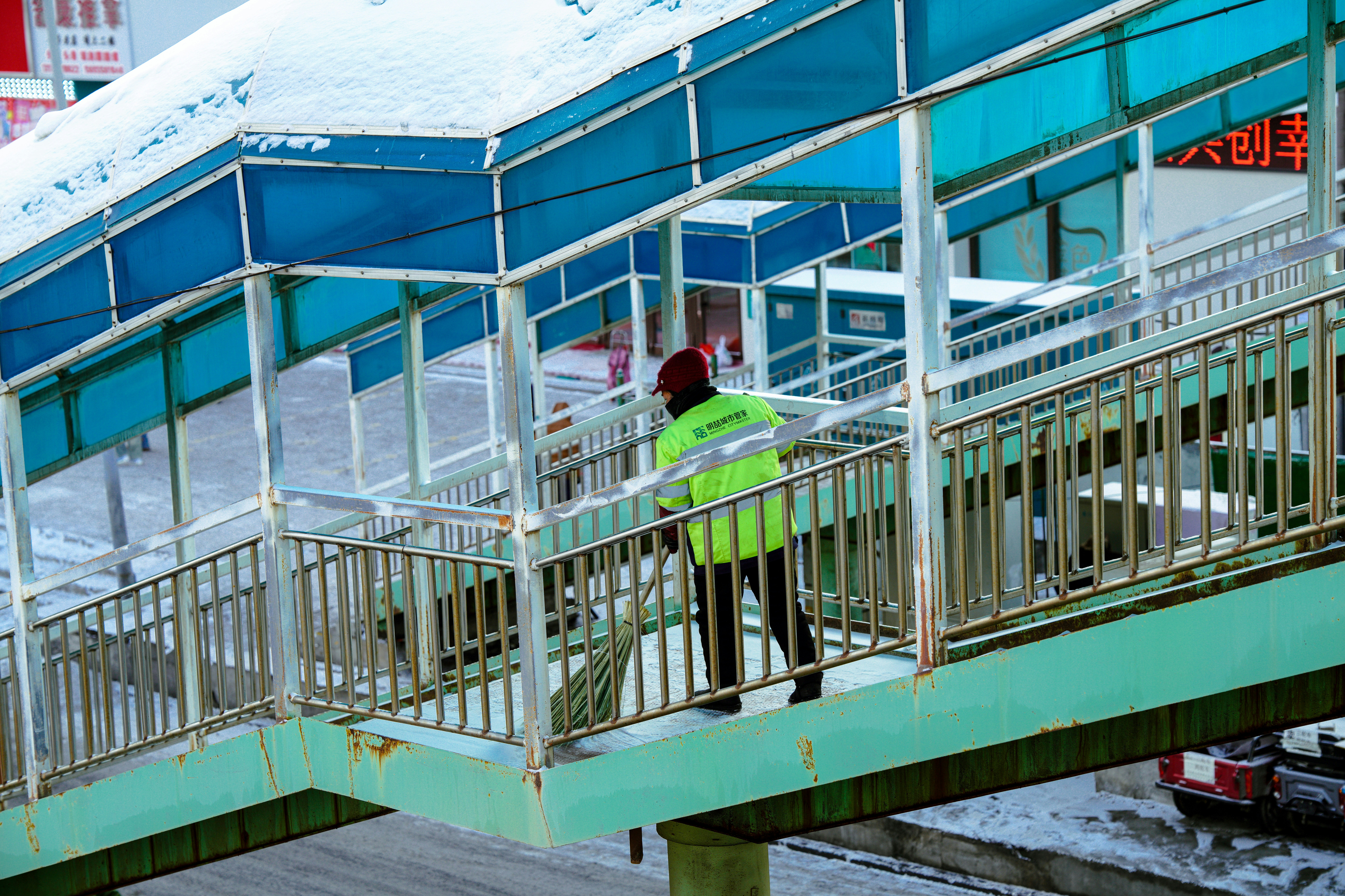 professional snow crew clearing walkway