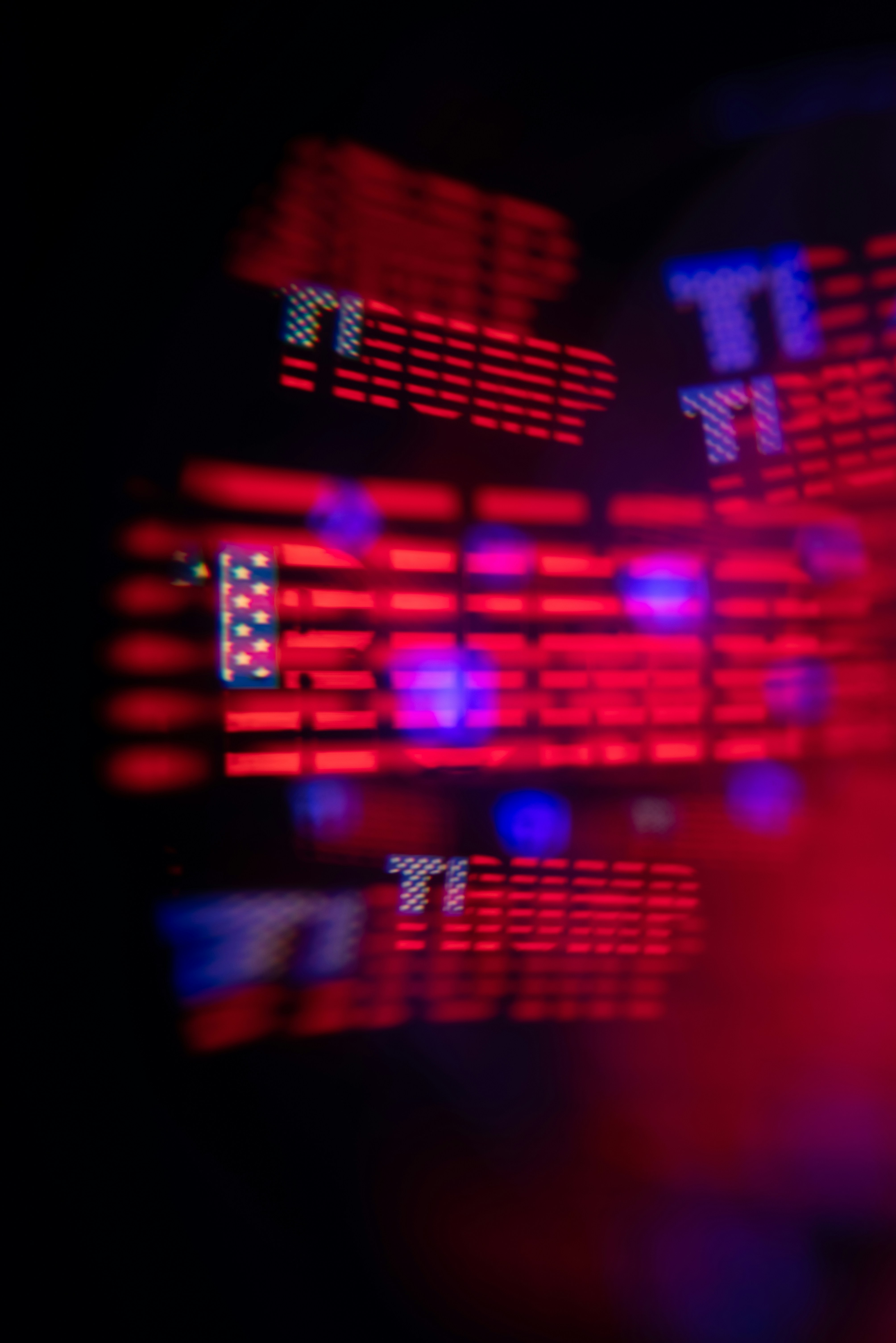 Blurred red and blue lights with american flag motif.