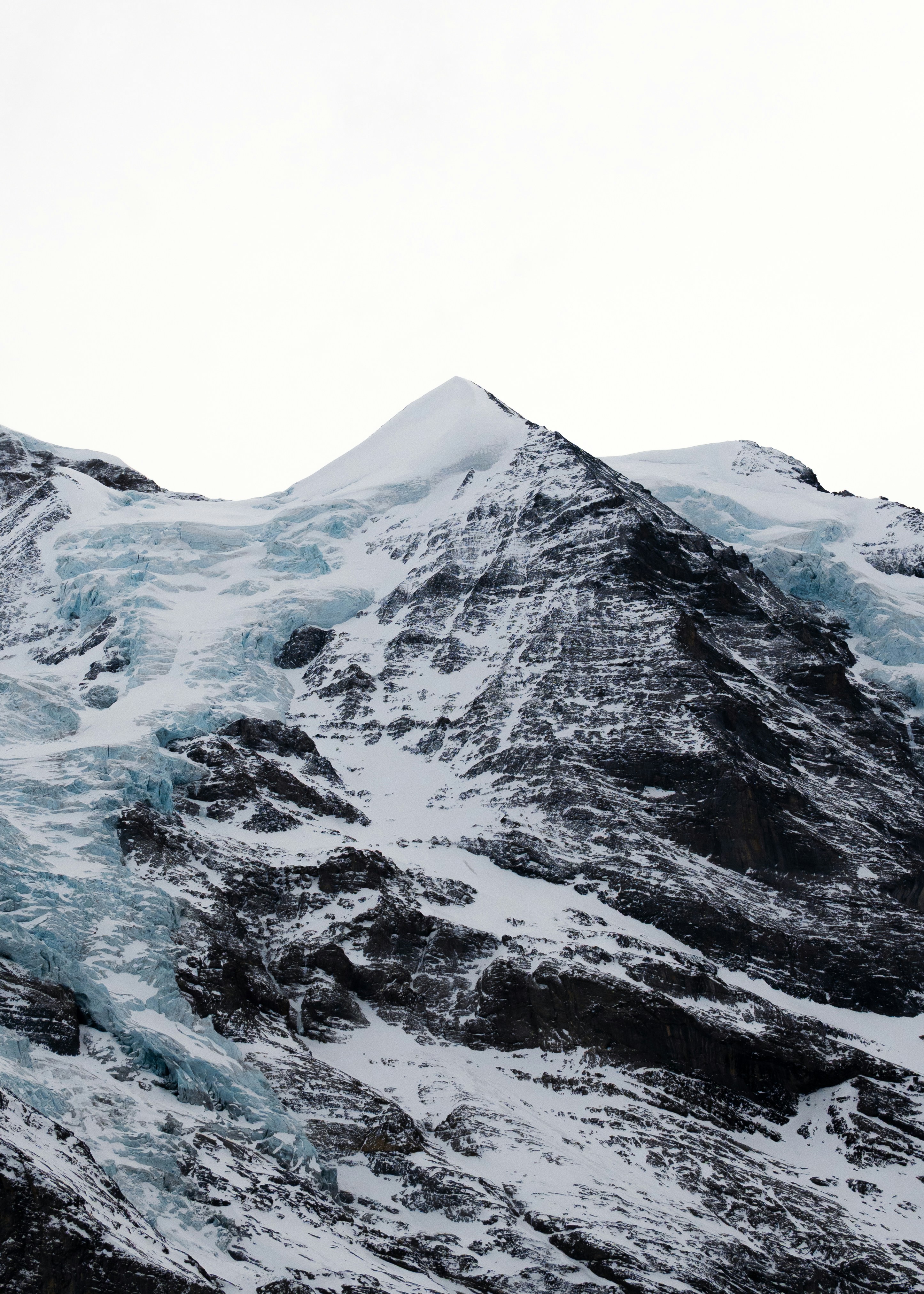 Snow-covered mountain peak with a glacier