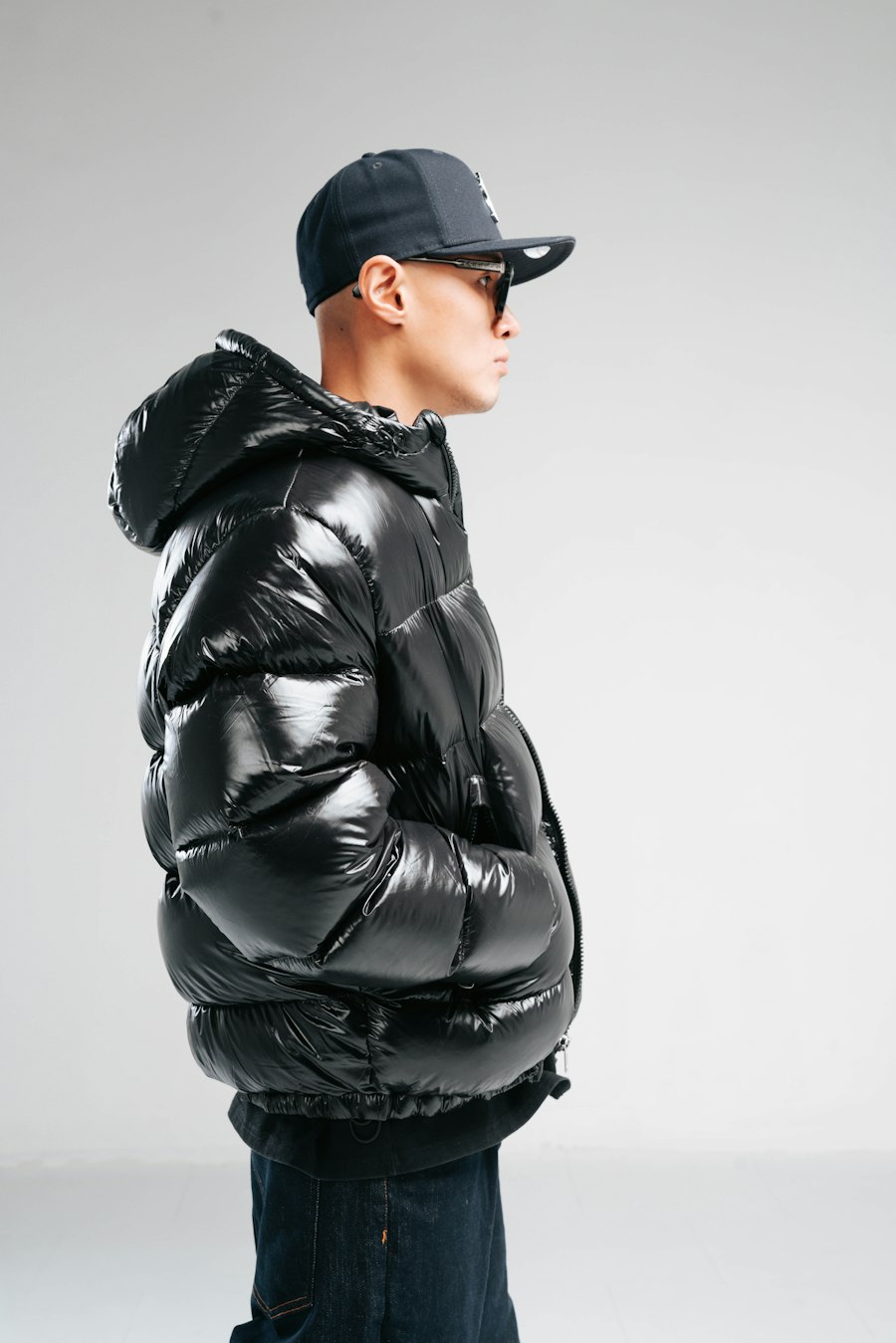 Side profile in a gloss black puffer