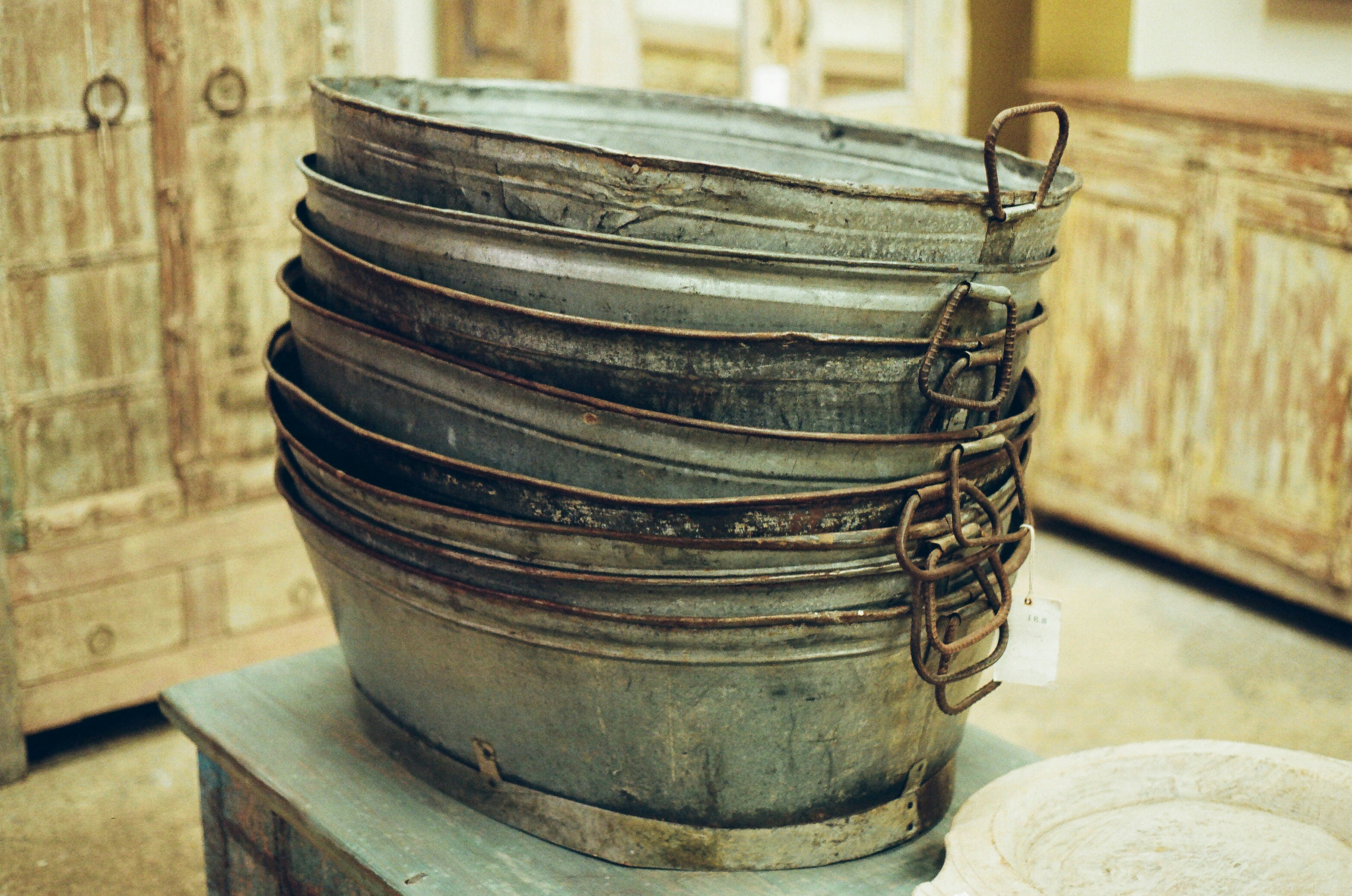 Stack of old metal wash tubs