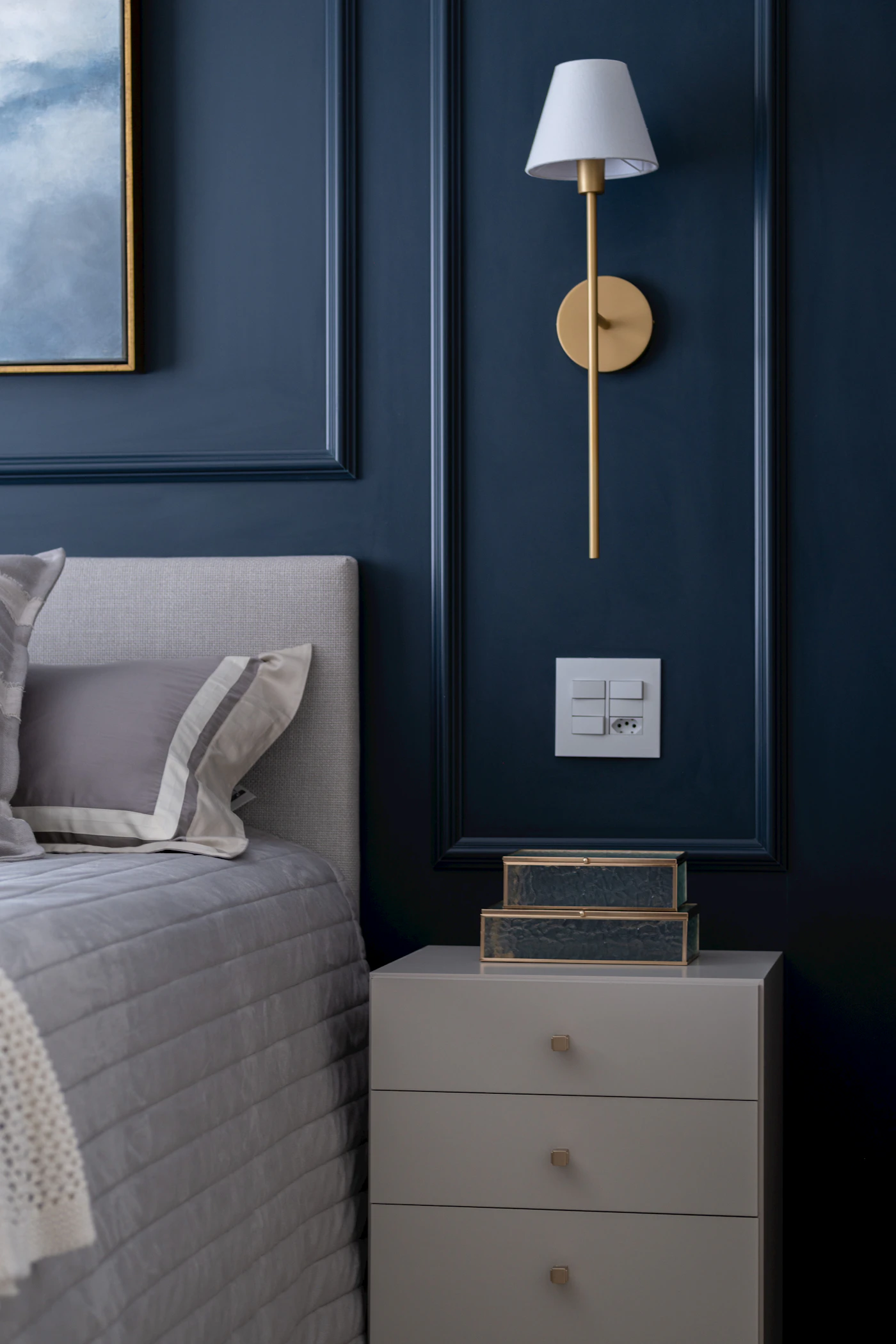 House of Still Light — bedroom in deep navy with crisp white bedding (placeholder photograph)