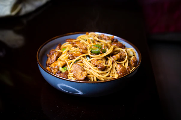 Bowl of spaghetti with meat and vegetables