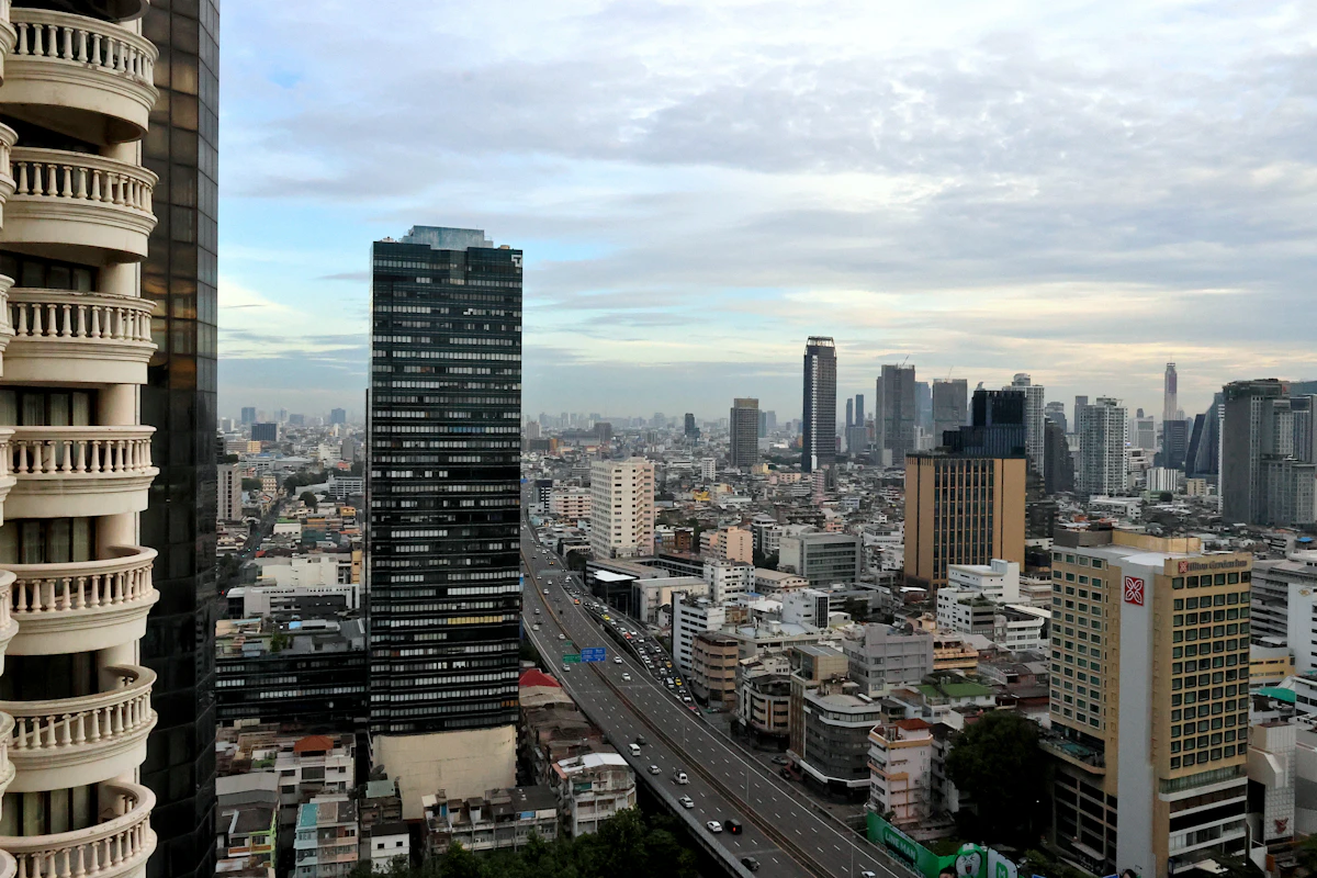 Bangkok skyline and highway, photographed in 2025; a contextual view of the host city