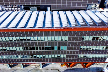 Modern building exterior with many windows and solar panels