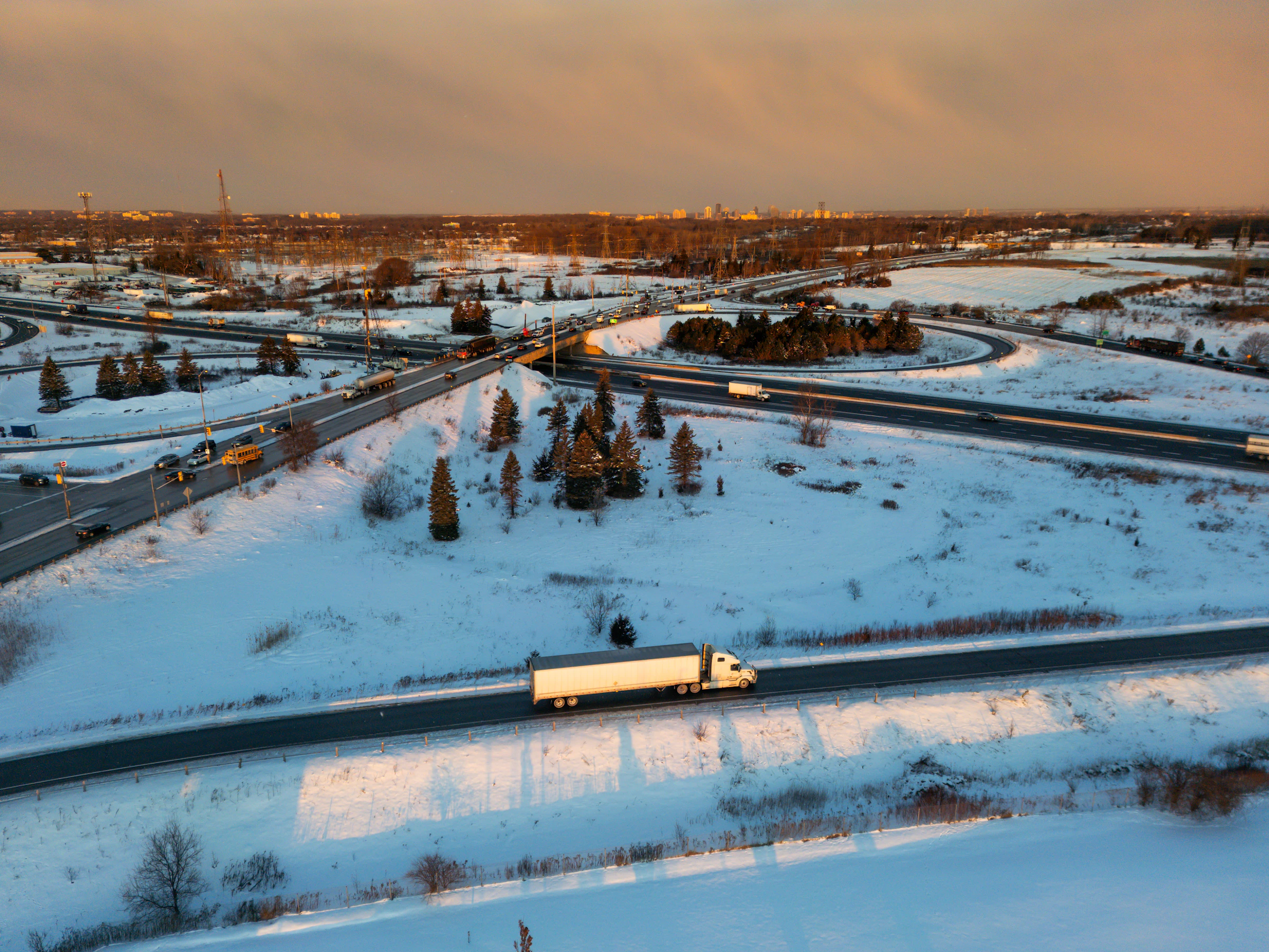 Truck on a winter highway seen from above