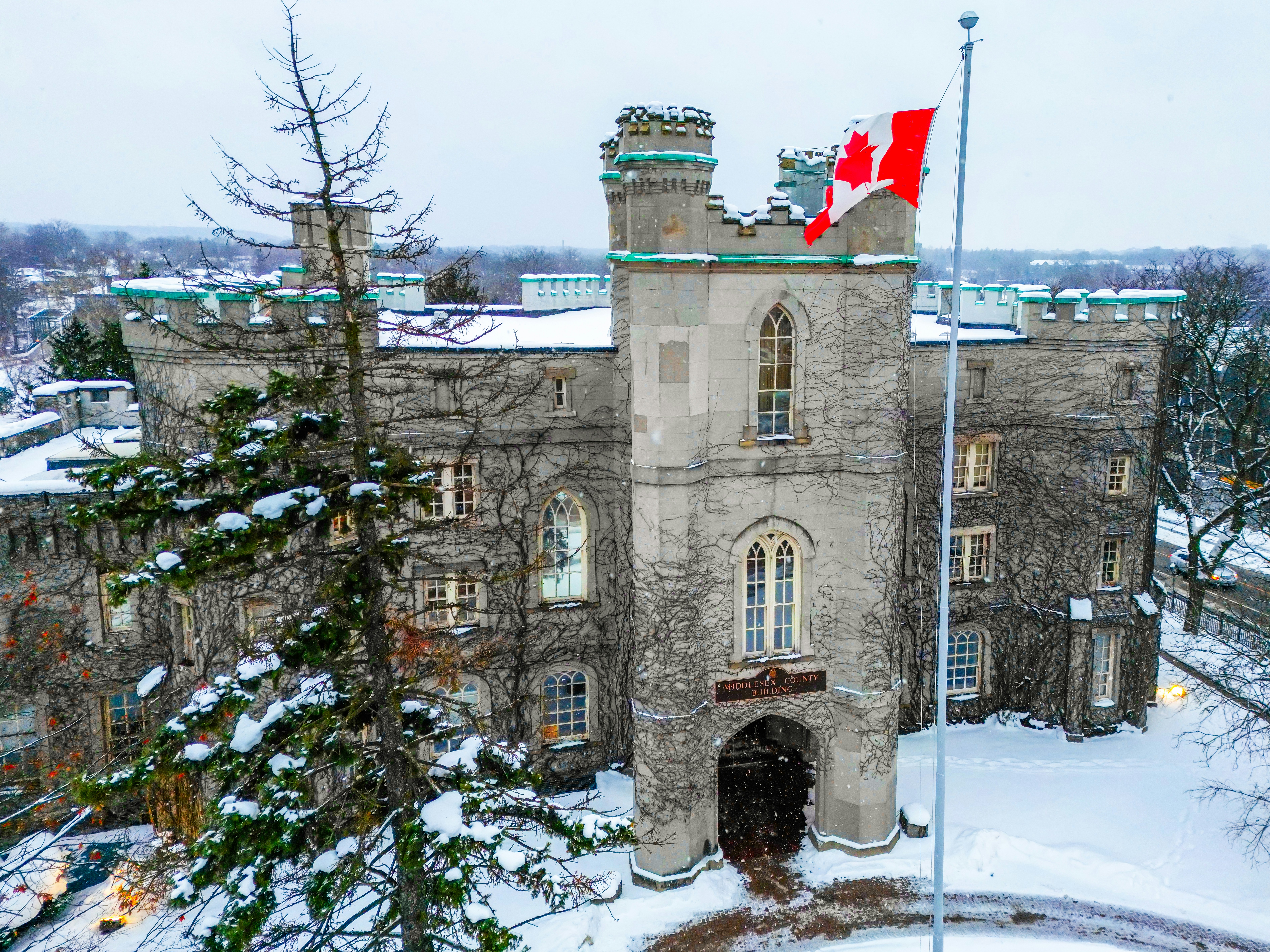 Castle with canadian flag in winter snow