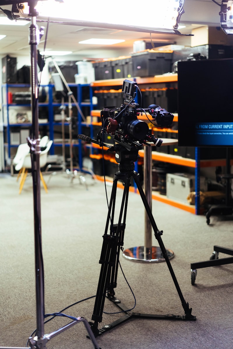 Professional broadcast camera on a tripod in a television studio
