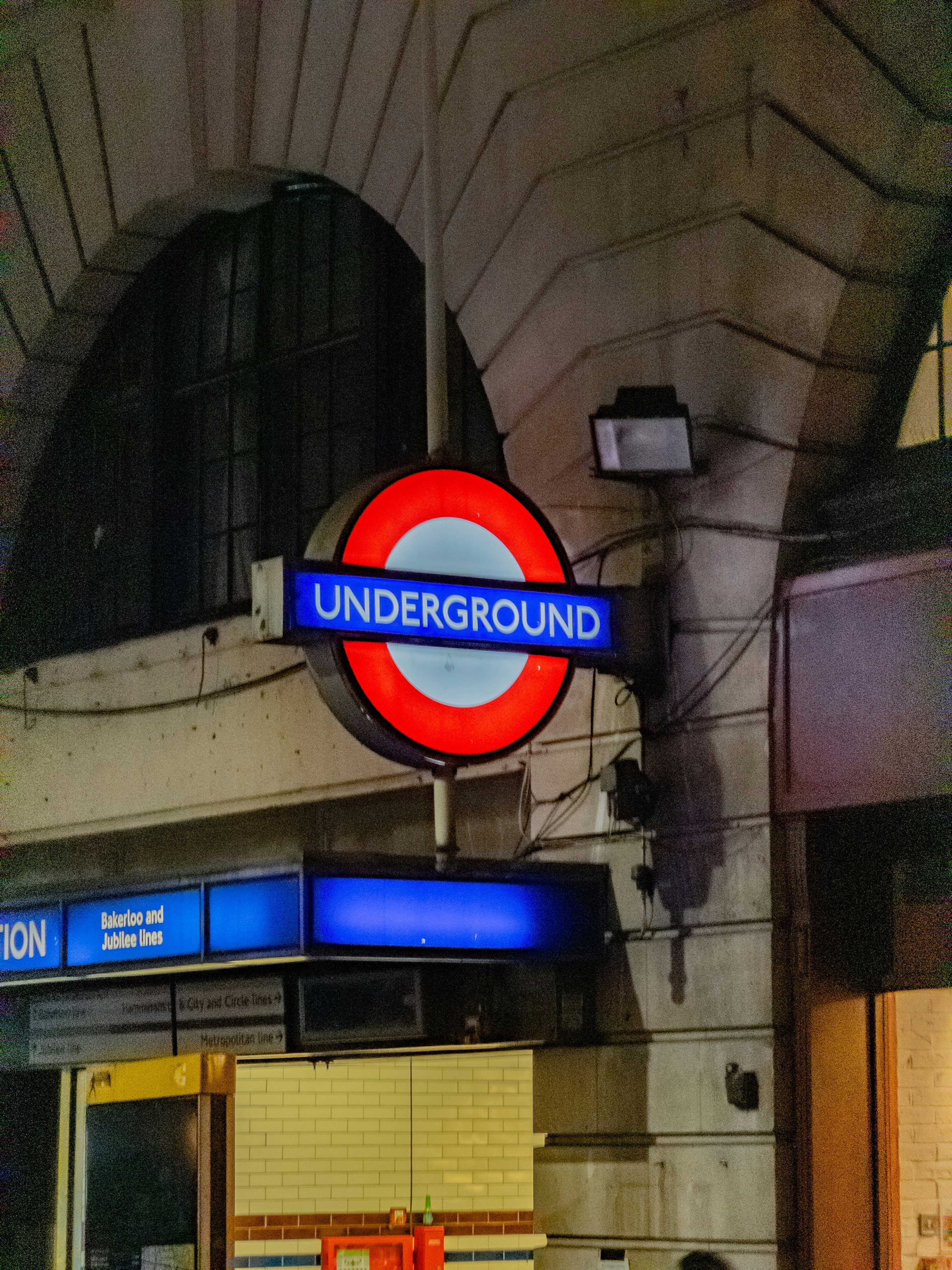 London underground station sign at night