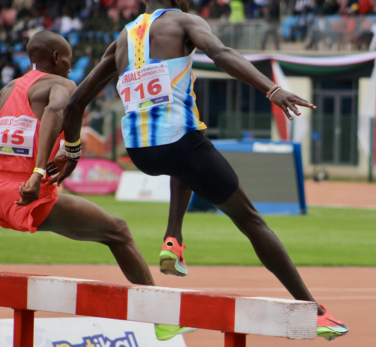 Athletes clearing hurdles of a track and field race, some strides open and easy between barriers and others requiring a full jump, analogous to a multi-turn conversation where some turns are an easy stretch of track and others demand the model's full effort
