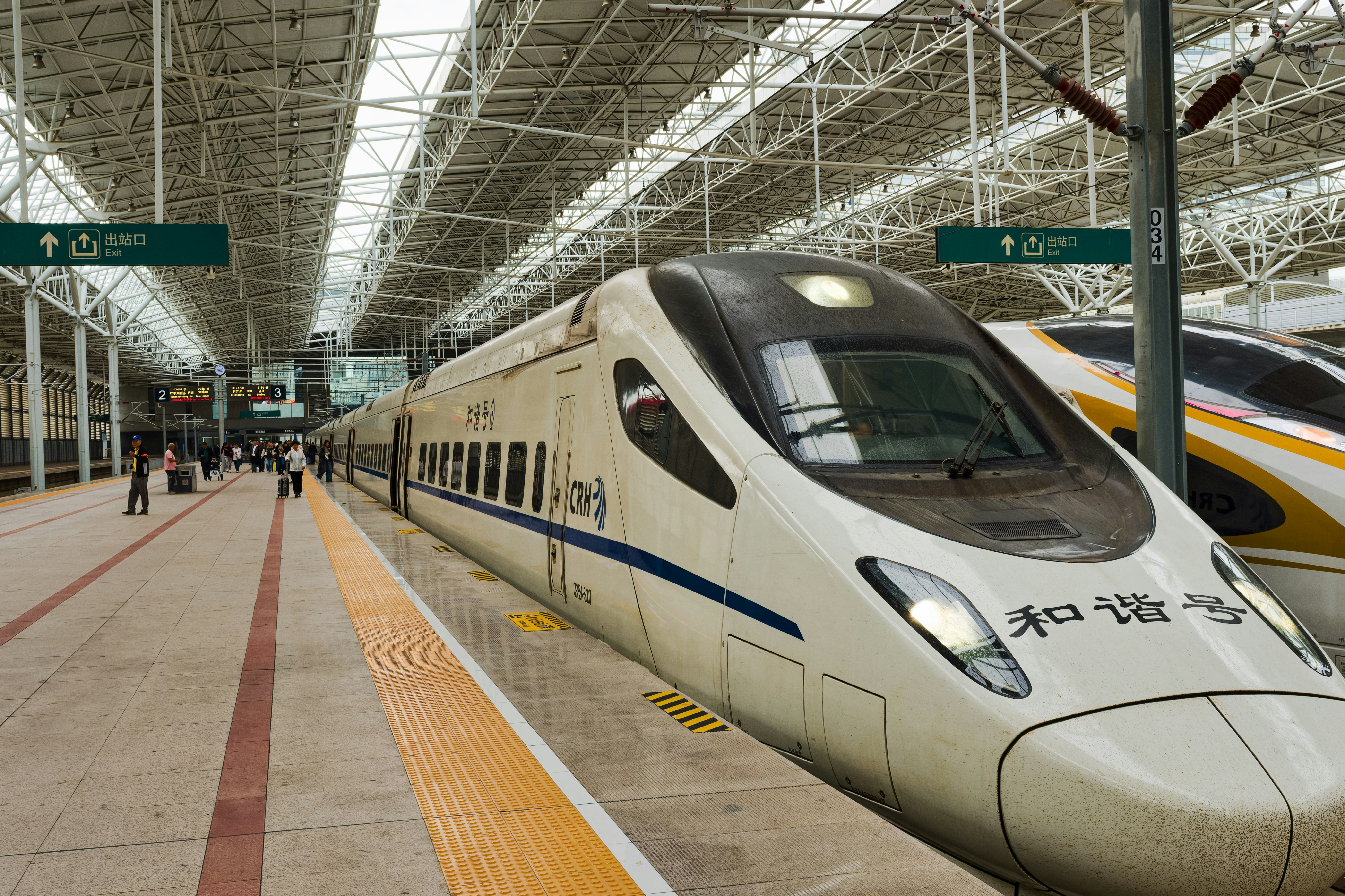 Modern high-speed train at a station platform.