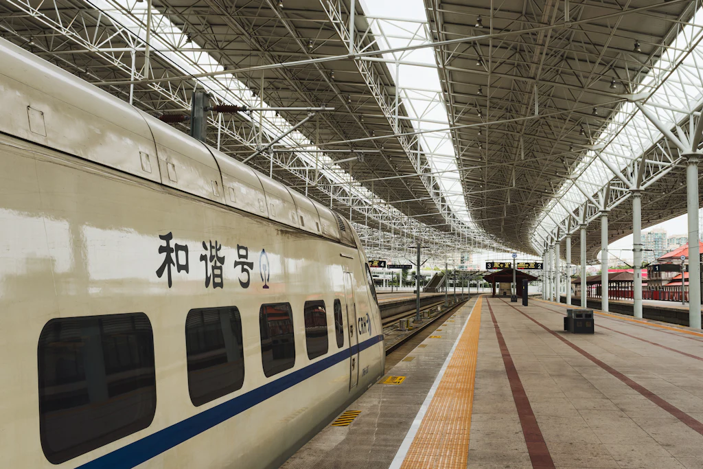 A China Railway high-speed train waiting beside a covered station platform