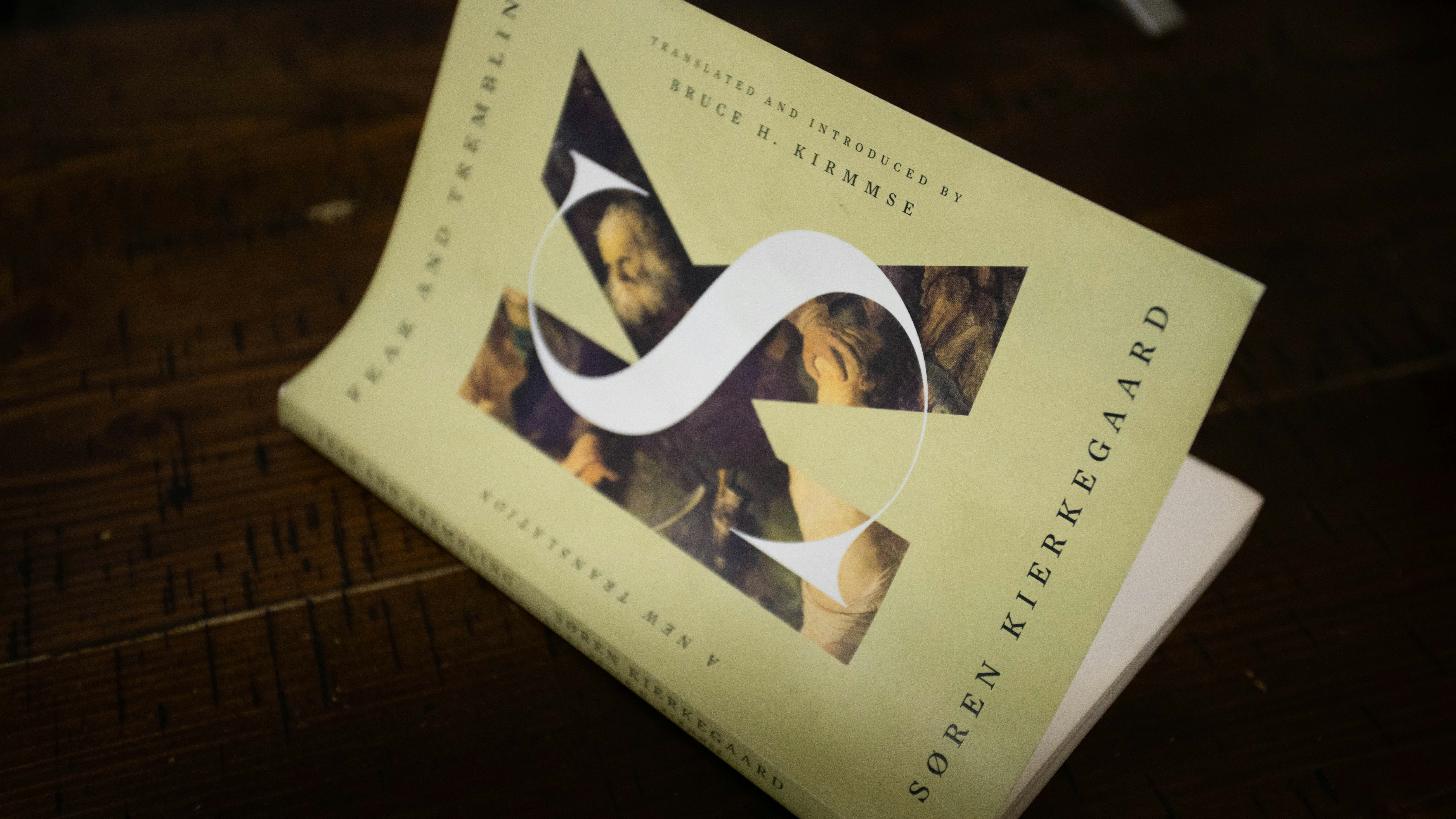 A book cover with a stylized s and a portrait.