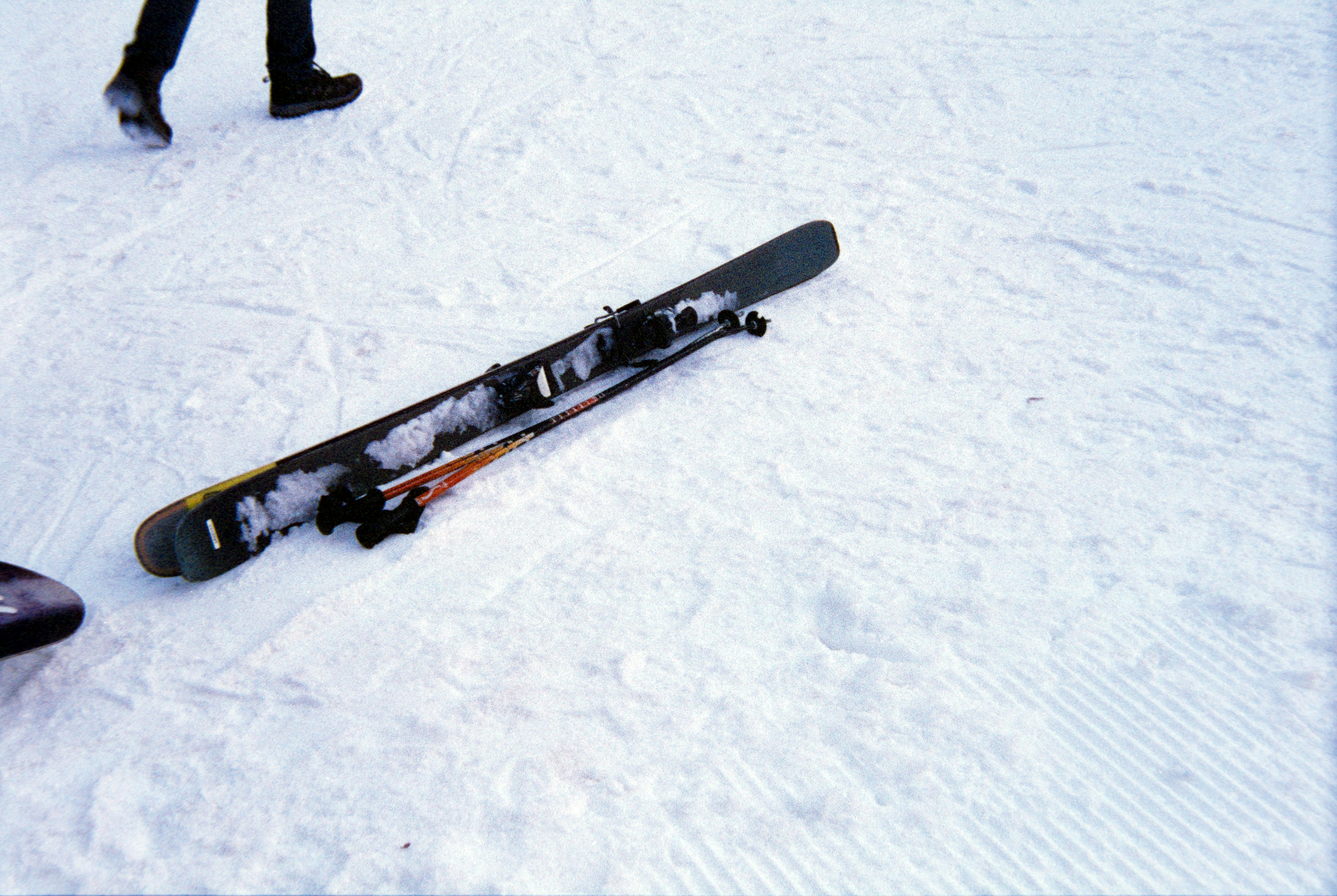 Skis and poles resting on snow