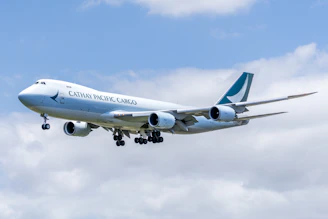 Cathay pacific cargo airplane flying in the sky