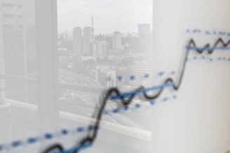 City skyline reflected on a graph