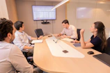 Business meeting with people around a conference table