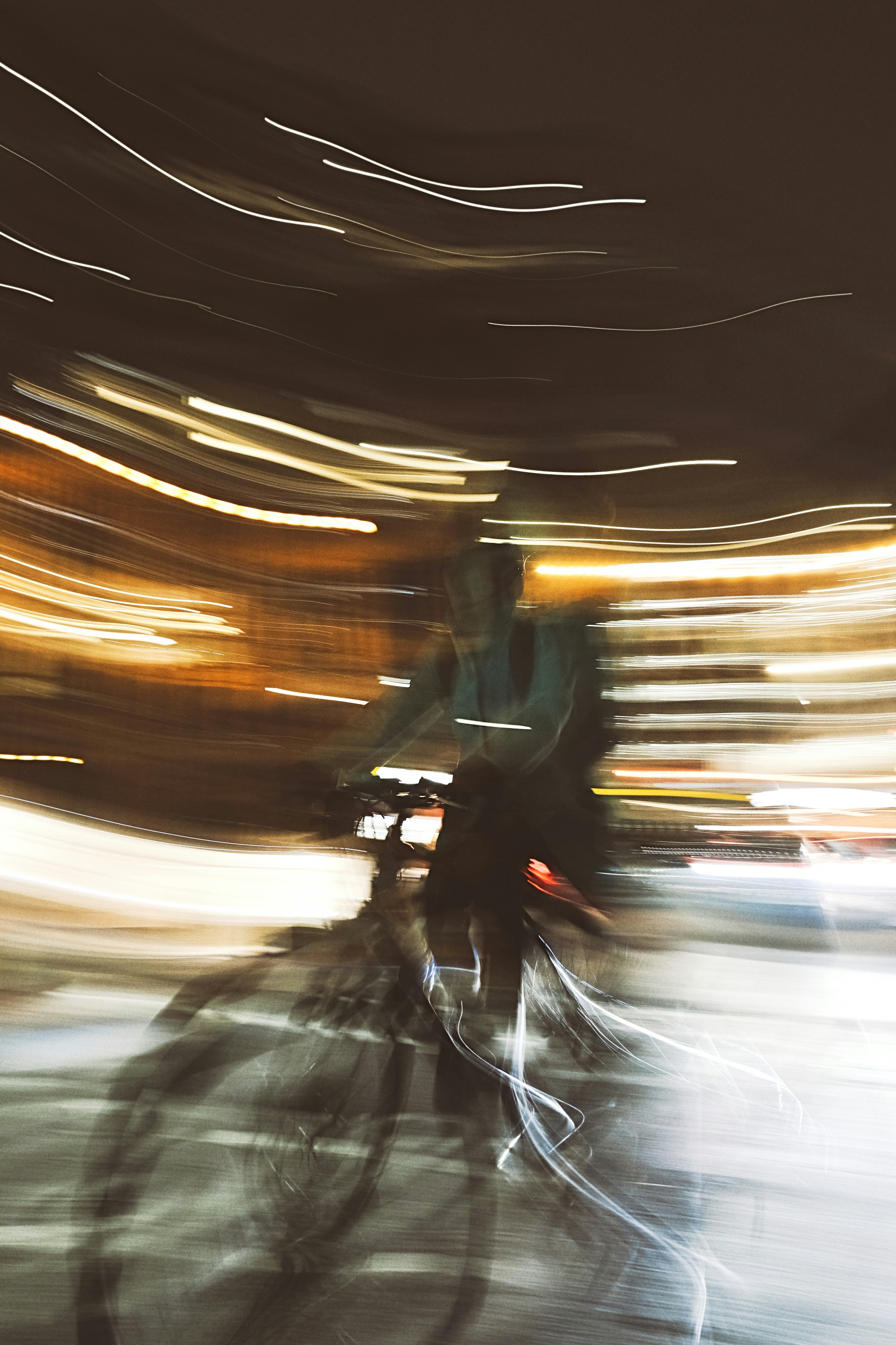 Abstract motion blur of a cyclist at night